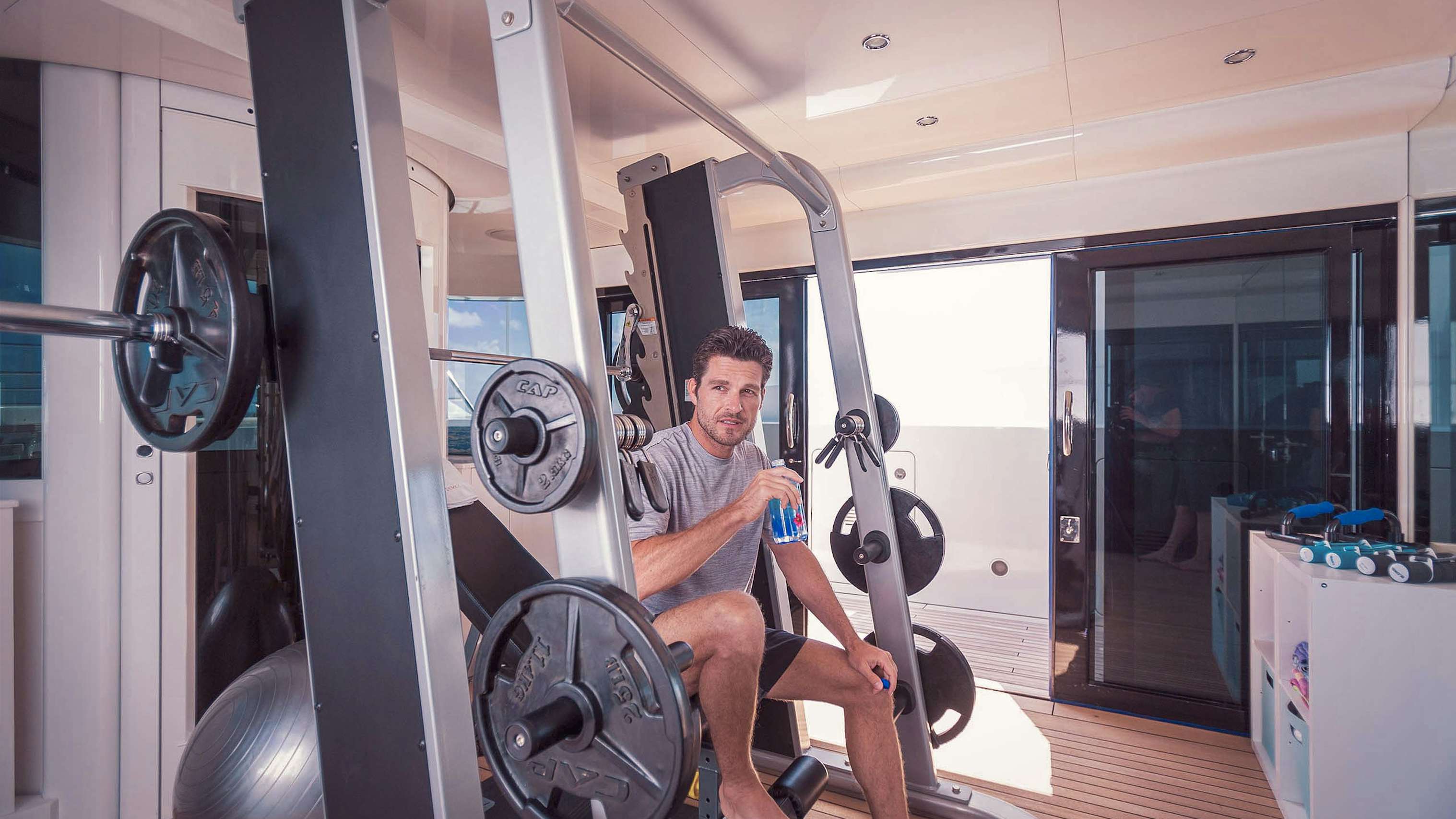 Gym on board charter yacht LUMIERE II in use during yacht charter