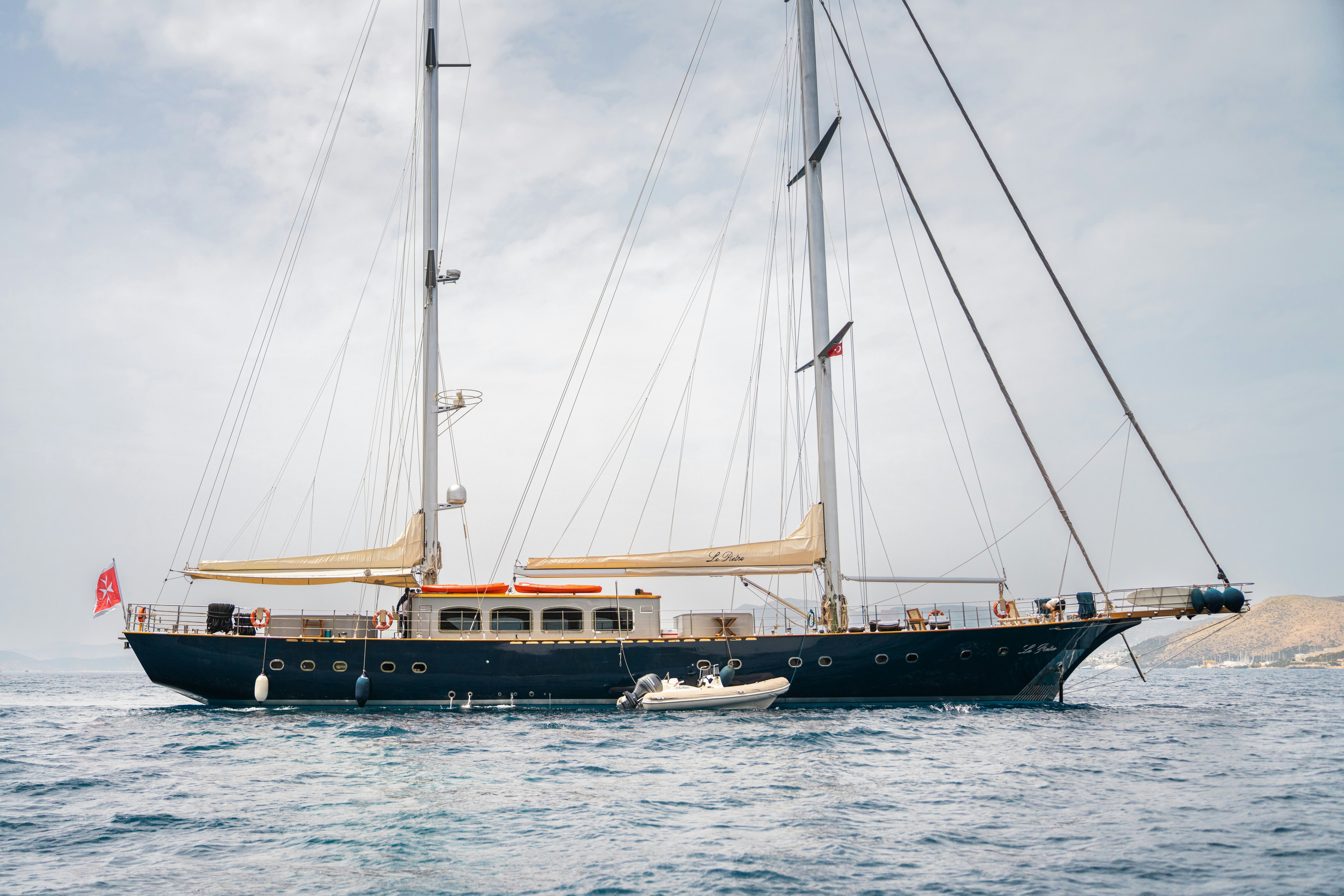 Le Pietre sailing yacht in the ocean with sails down
