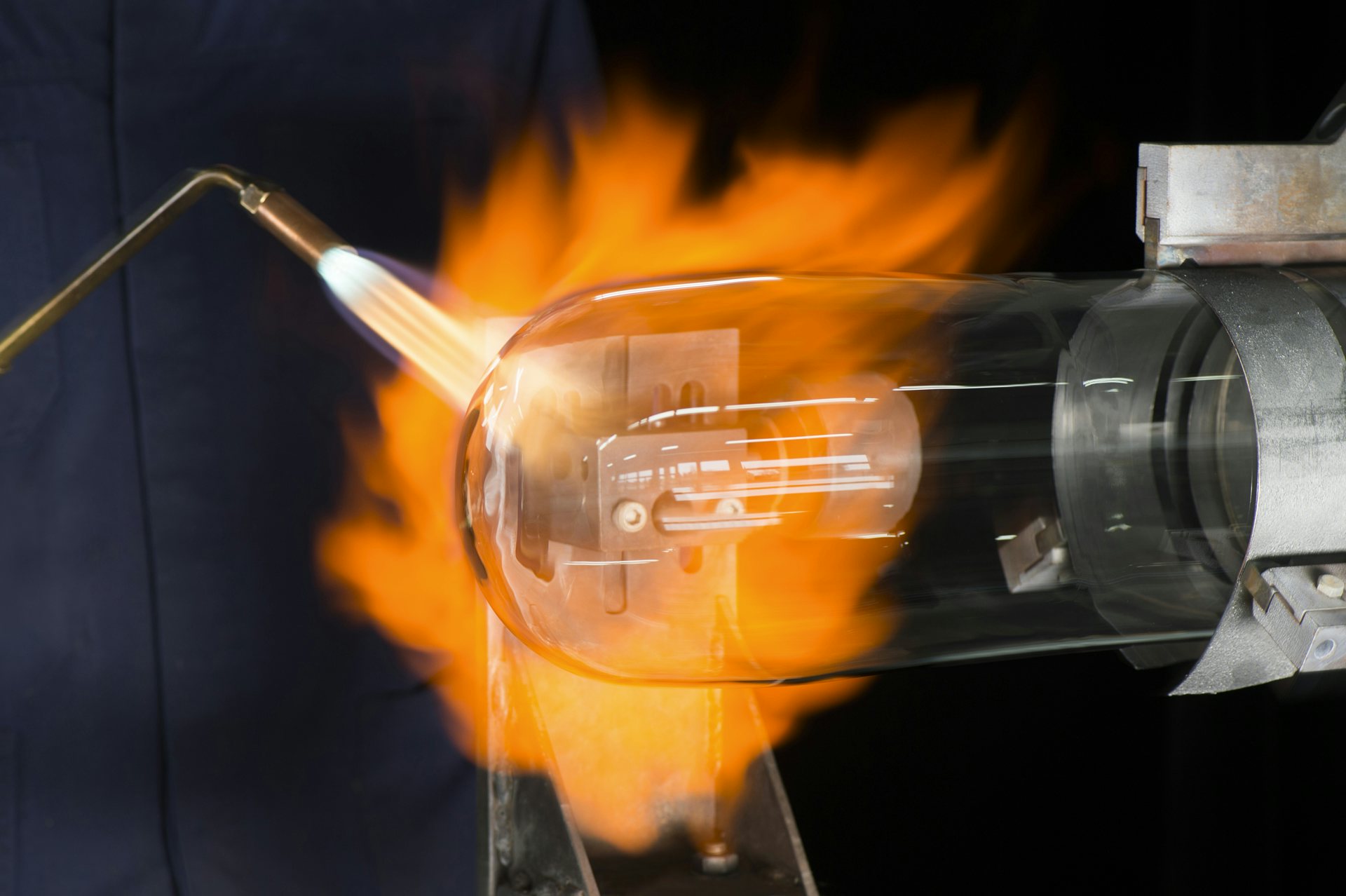 Horologist using a blow torch to mold the glass on Ulysse Nardin&#039;s UFO timepiece