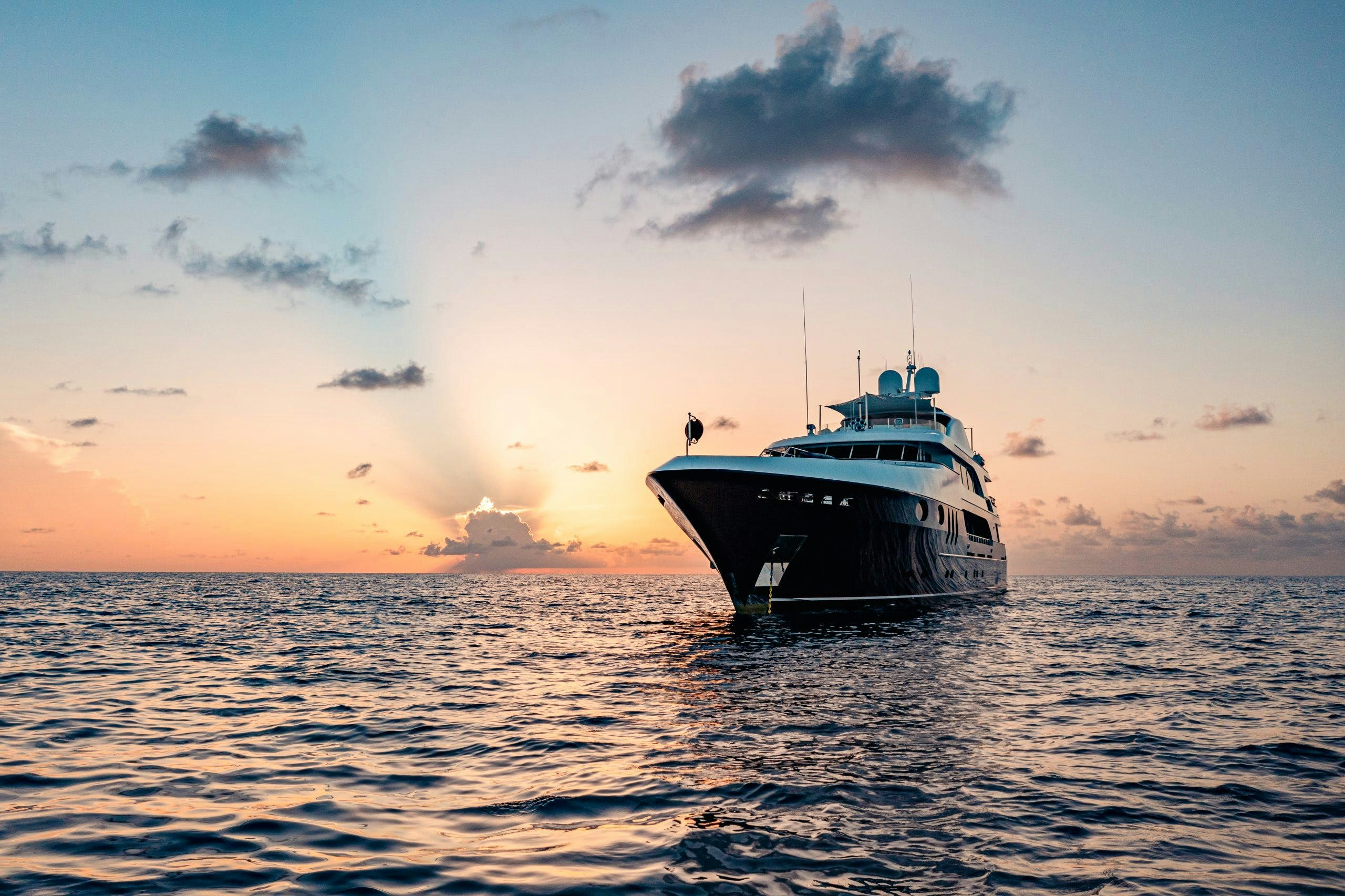 MIRABELLA on the water at sunset