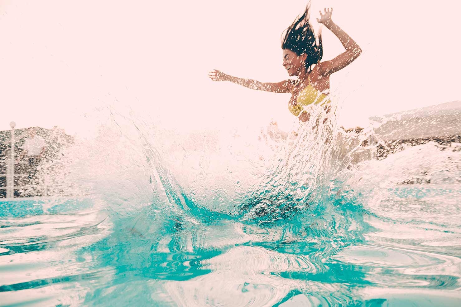Women playing in the ocean at Nikki Beach