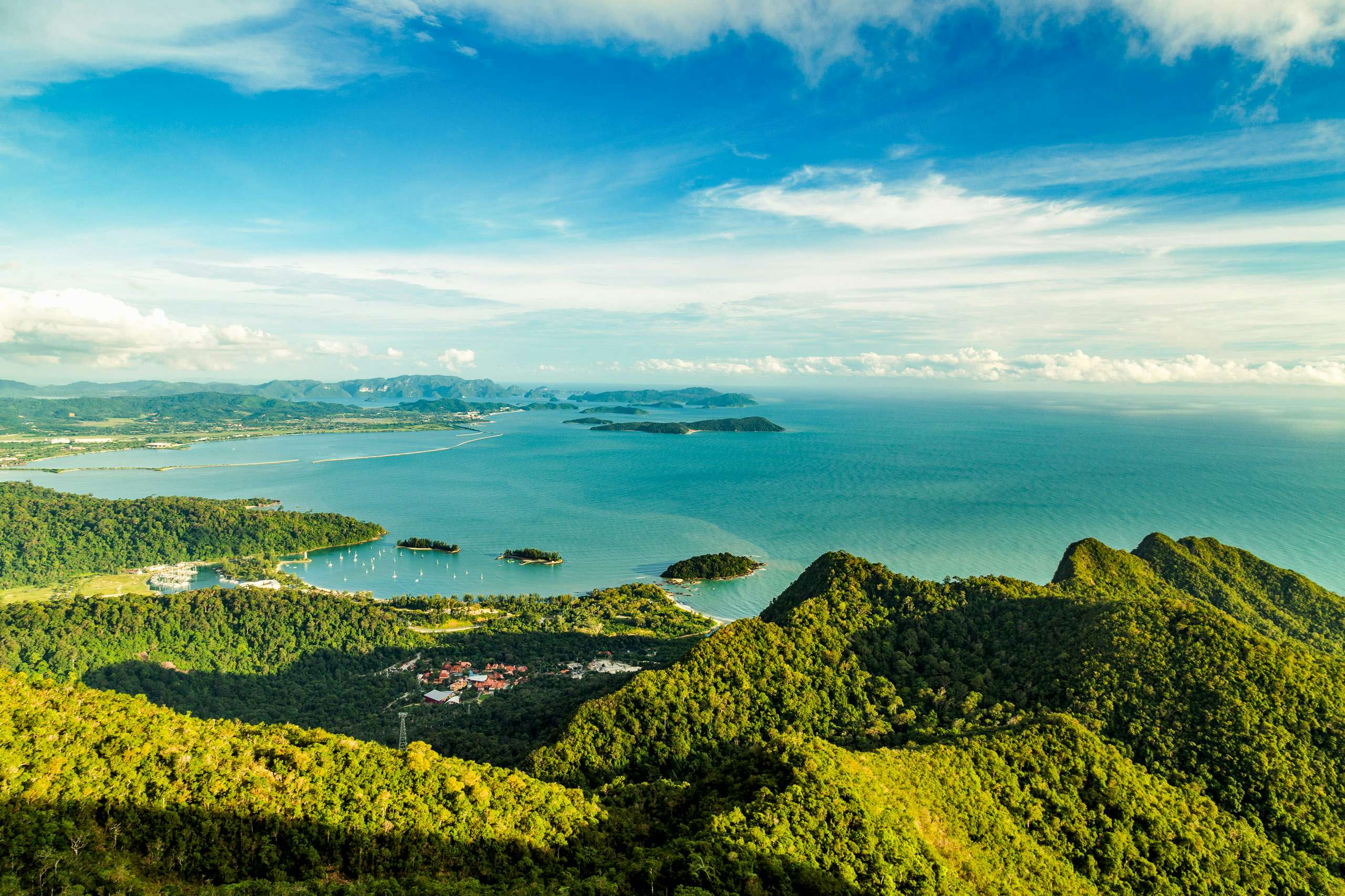 Malaysia Yacht Charter - Langkawi Yacht Charter View of tropical island Langkawi in Malaysia, covered with tropical forests. Aerial view on the bay, marina and archipelago of smaller islands in Andaman sea