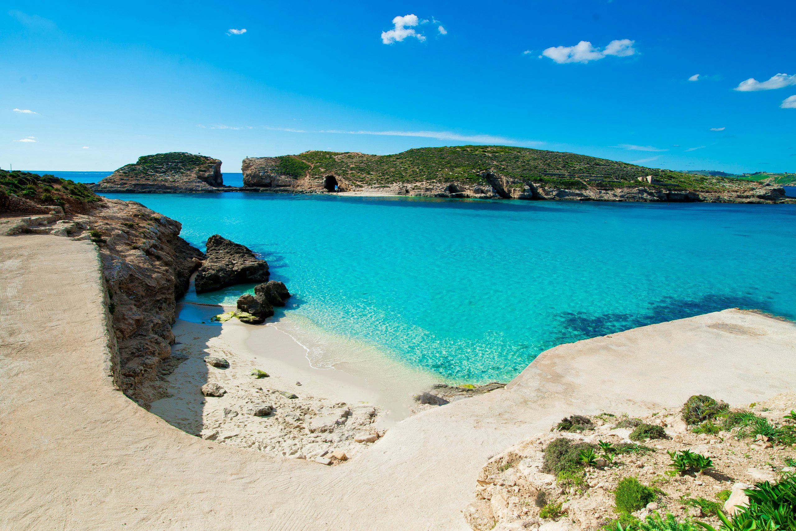 Crystal-clear turquoise waters of Comino's Blue Lagoon, ideal for an exclusive yacht charter in Malta.
