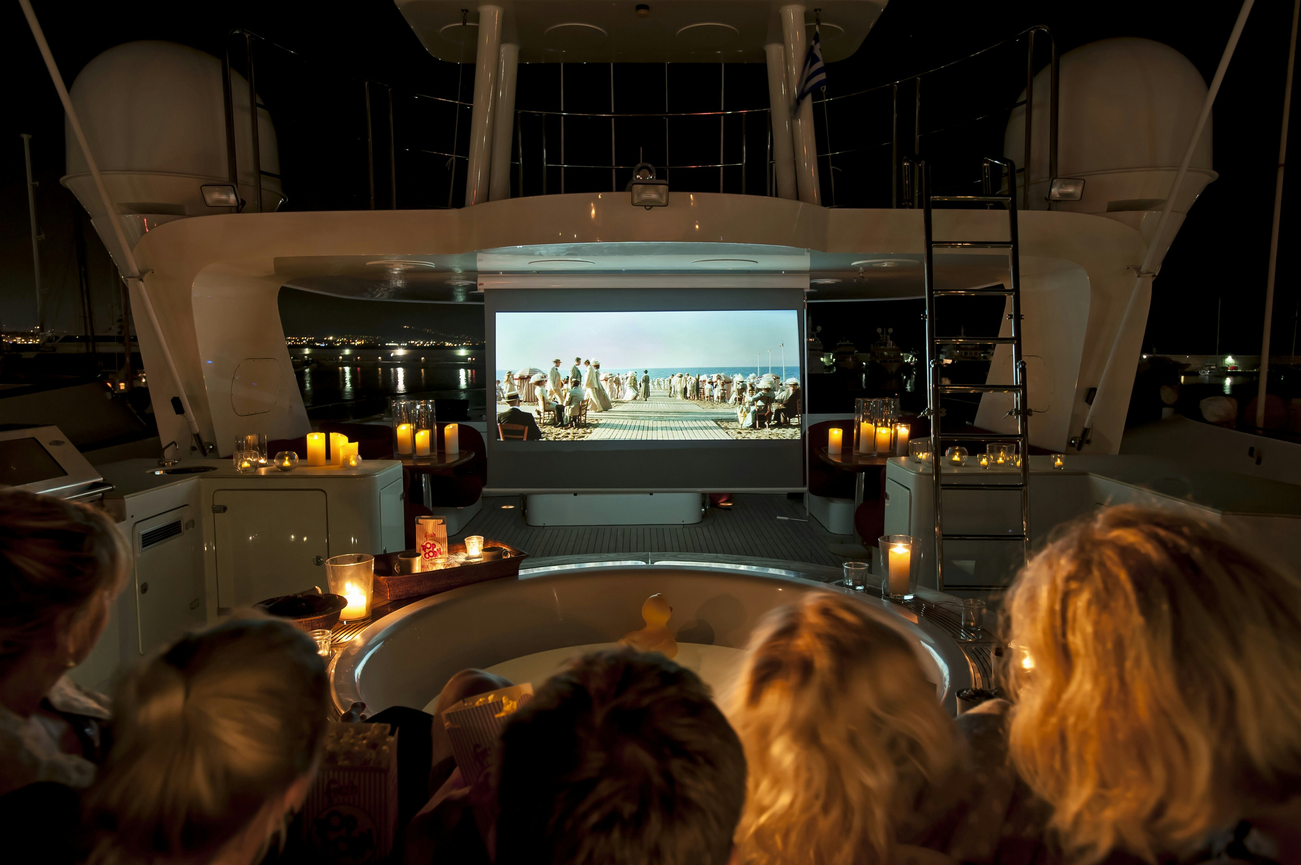a movie at night on the sundeck of yacht Metsuyan