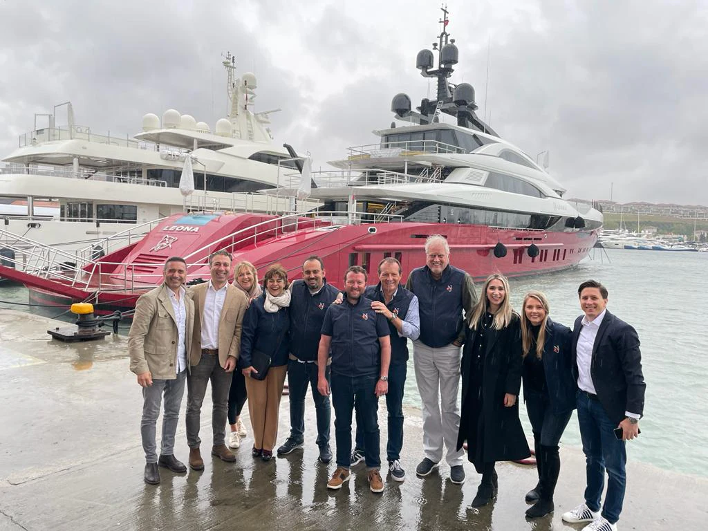 NJ brokers at a shipyard in turkey in front of a yacht