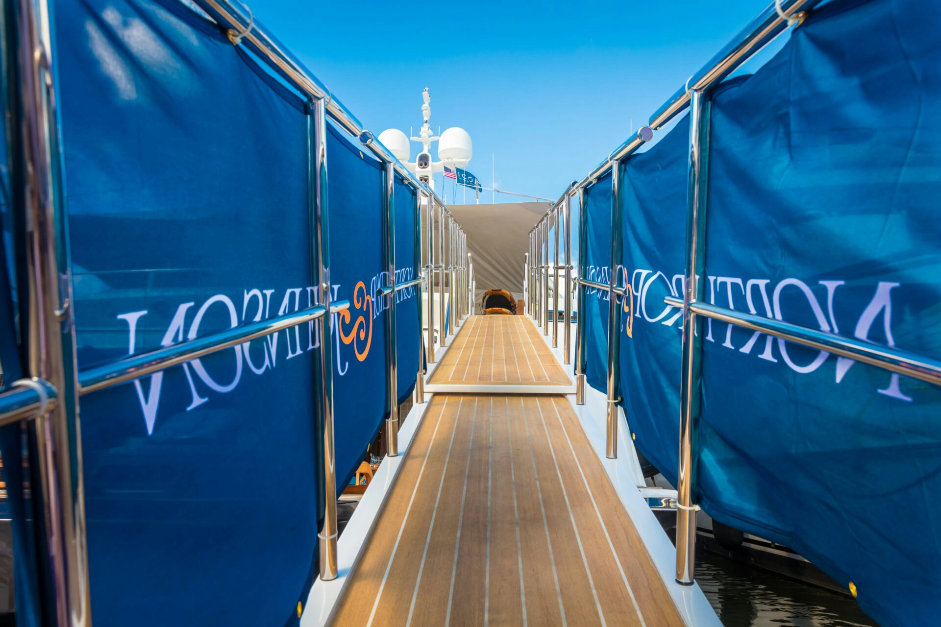 Northrop & Johnson Yacht Gangway: Your Gateway to Luxury at the Miami International Boat Show The Northrop & Johnson yacht gangway, an elegant entry point to a luxurious charter yacht during the Miami International Boat Show.