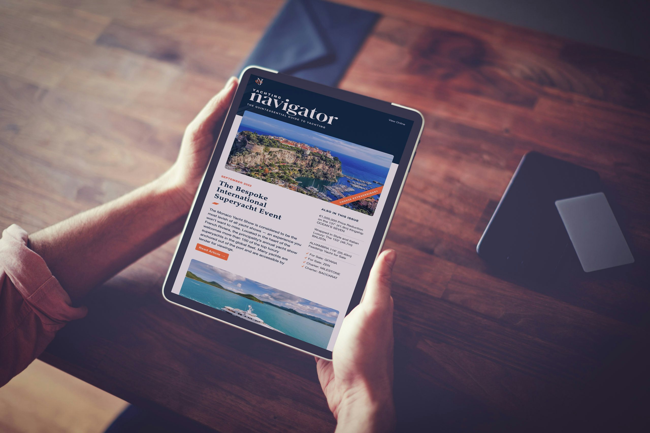 Navigator Newsletter Man hands holding digital tablet with Navigator newsletter on screen