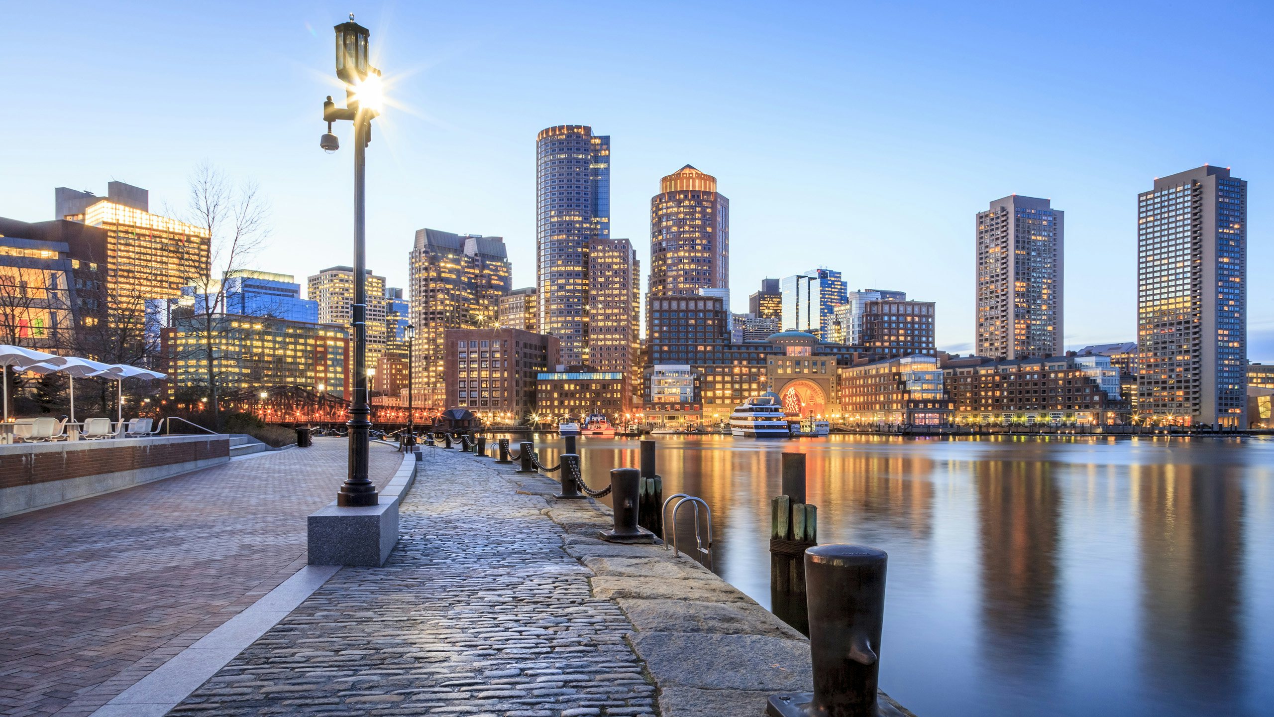 New England Crewed Yacht Charter -Crewed Yacht Charter -New England_Boston New England Crewed Yacht Charter -Boston, MA, Skyline at dusk with city lights and water
