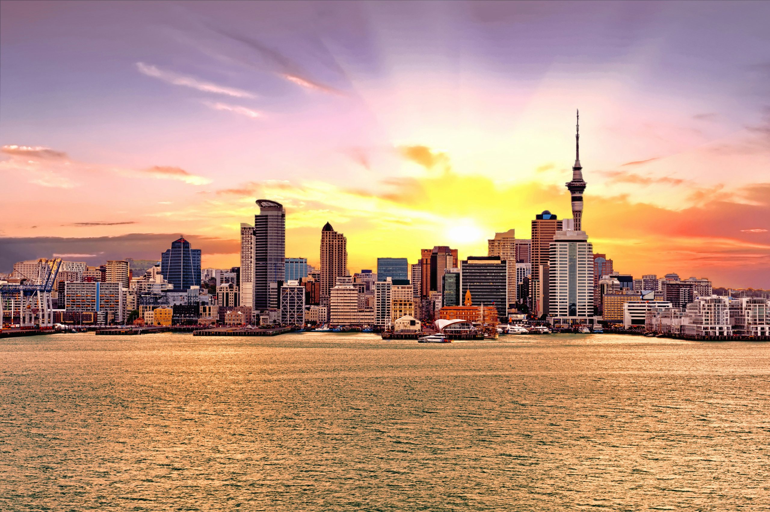 Auckland Yacht Charter - Skyline of Auckland, New Zealand at sunset