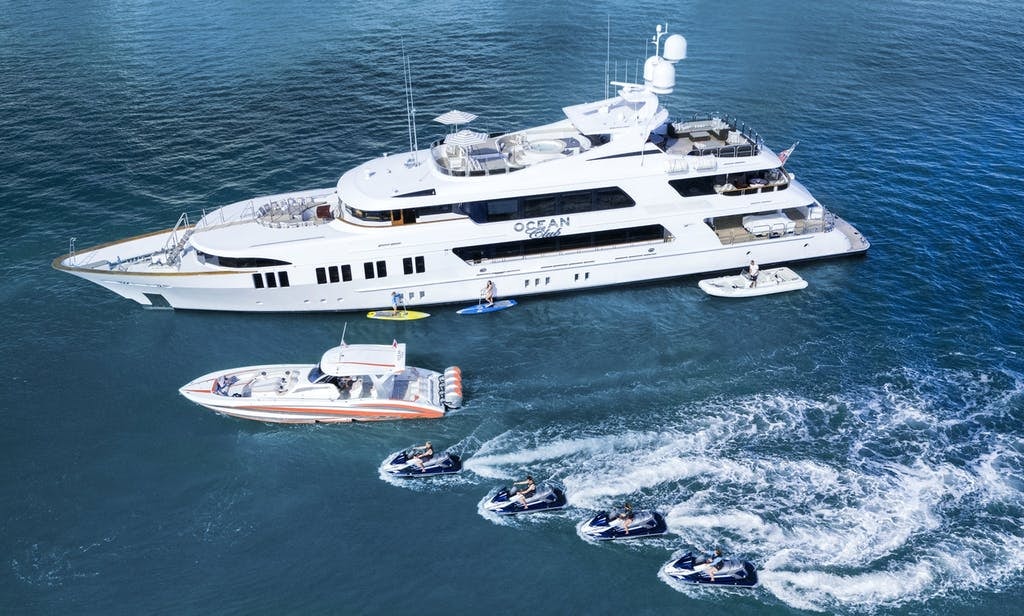 164' (50m) trinity charter yacht OCEAN CLUB profile with tender and jetskis in front