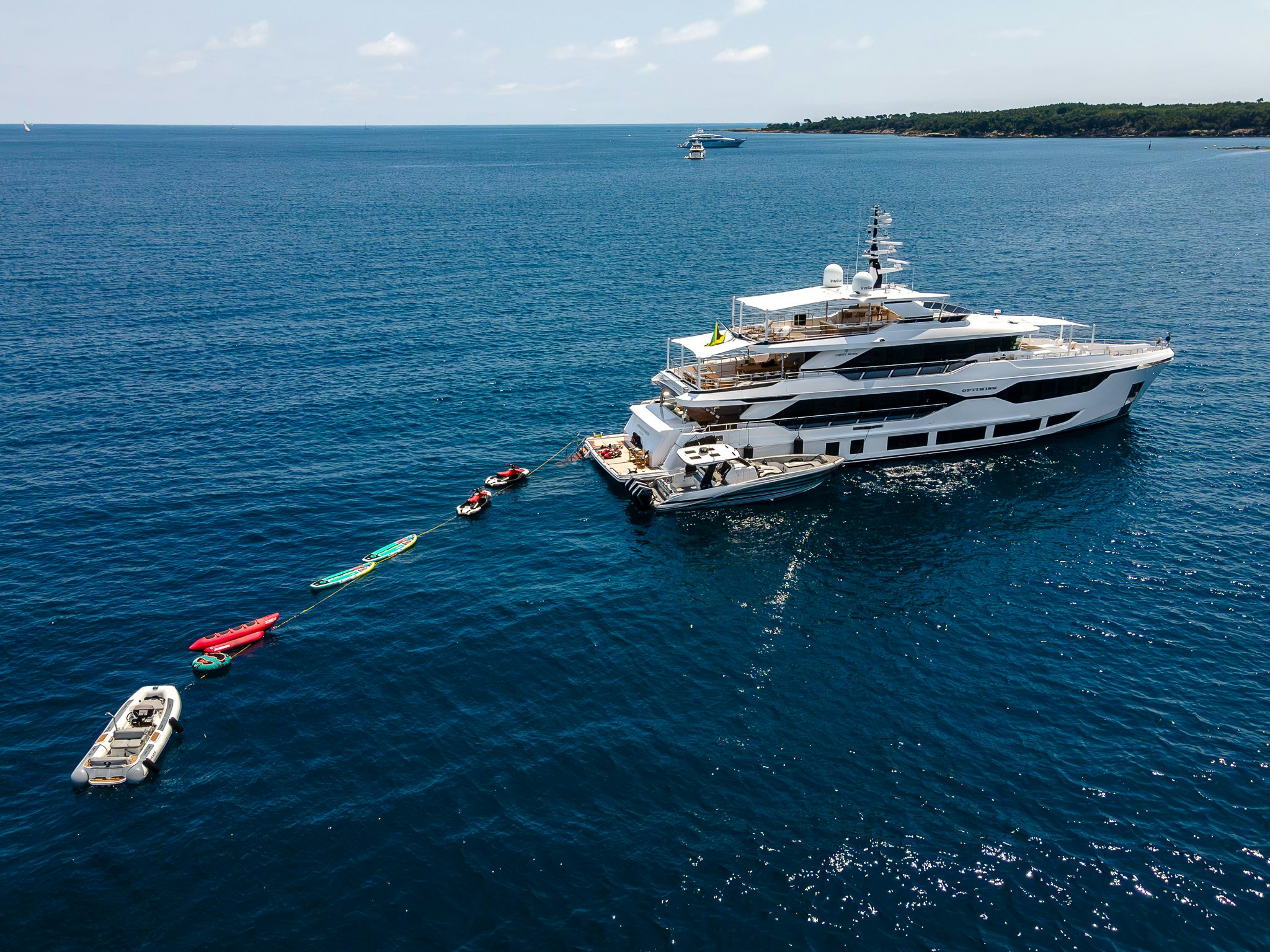 toys put out from white yacht OPTIMISM in the blue ocean