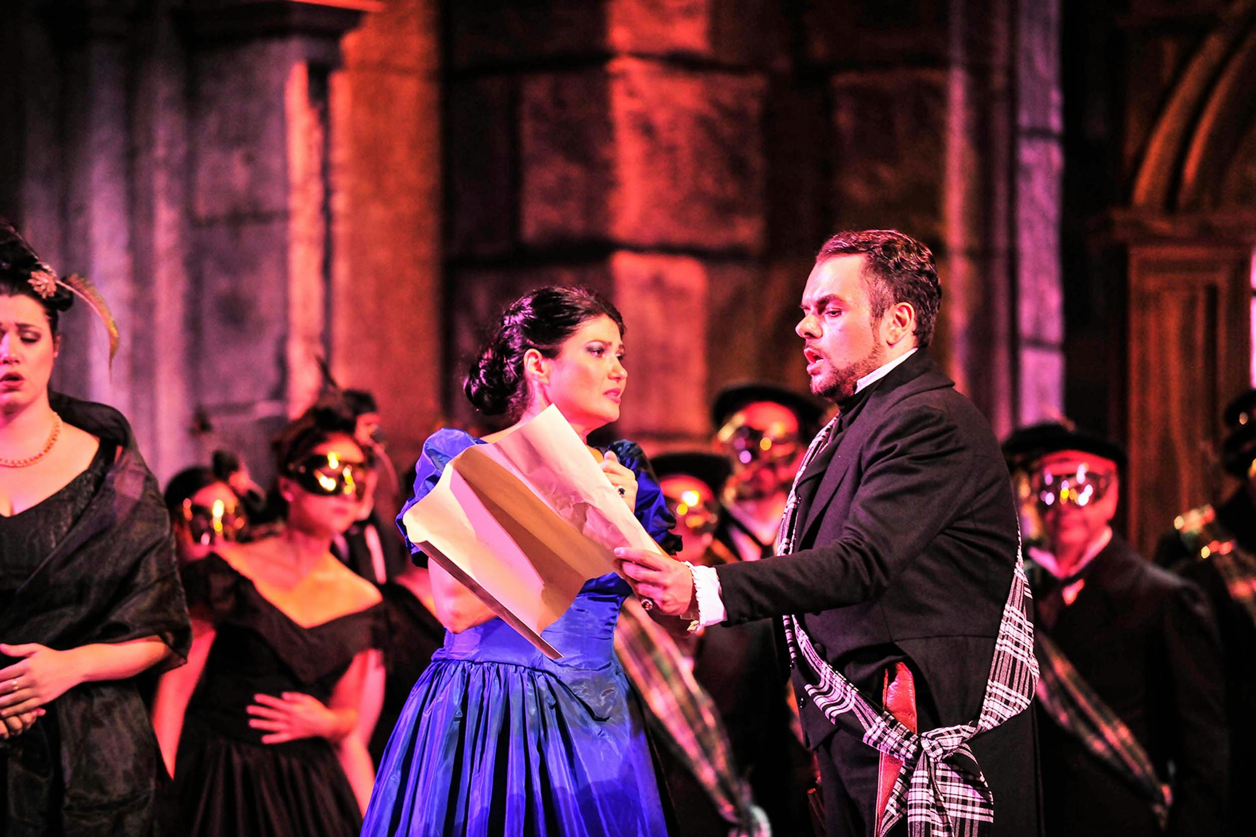 dramatic image of two opera singers on stage