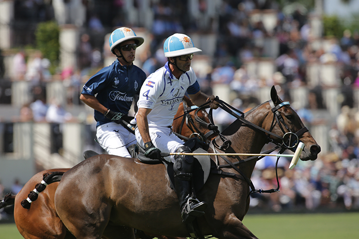 Palm Beach polo with two men on horses playing in palm beach