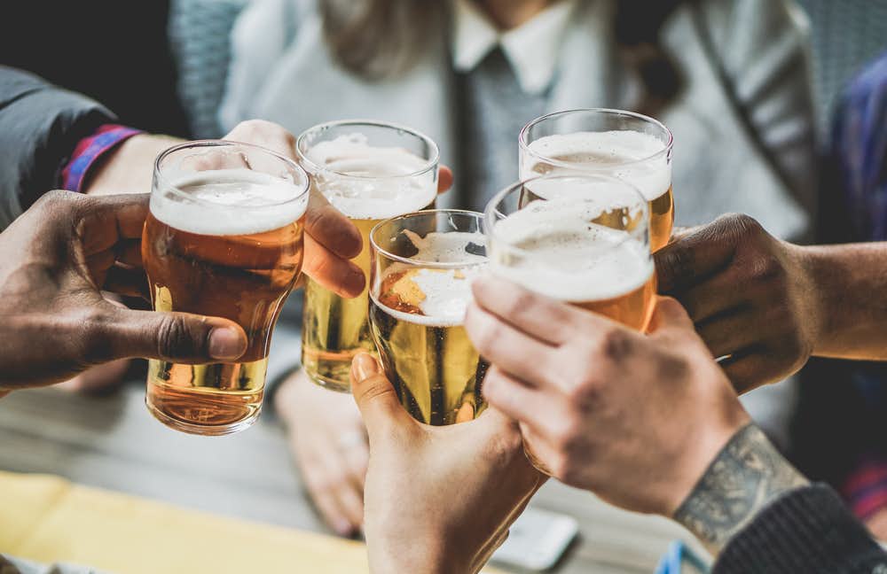 Group,Of,Friends,Enjoying,A,Beer,In,Brewery,Pub,-