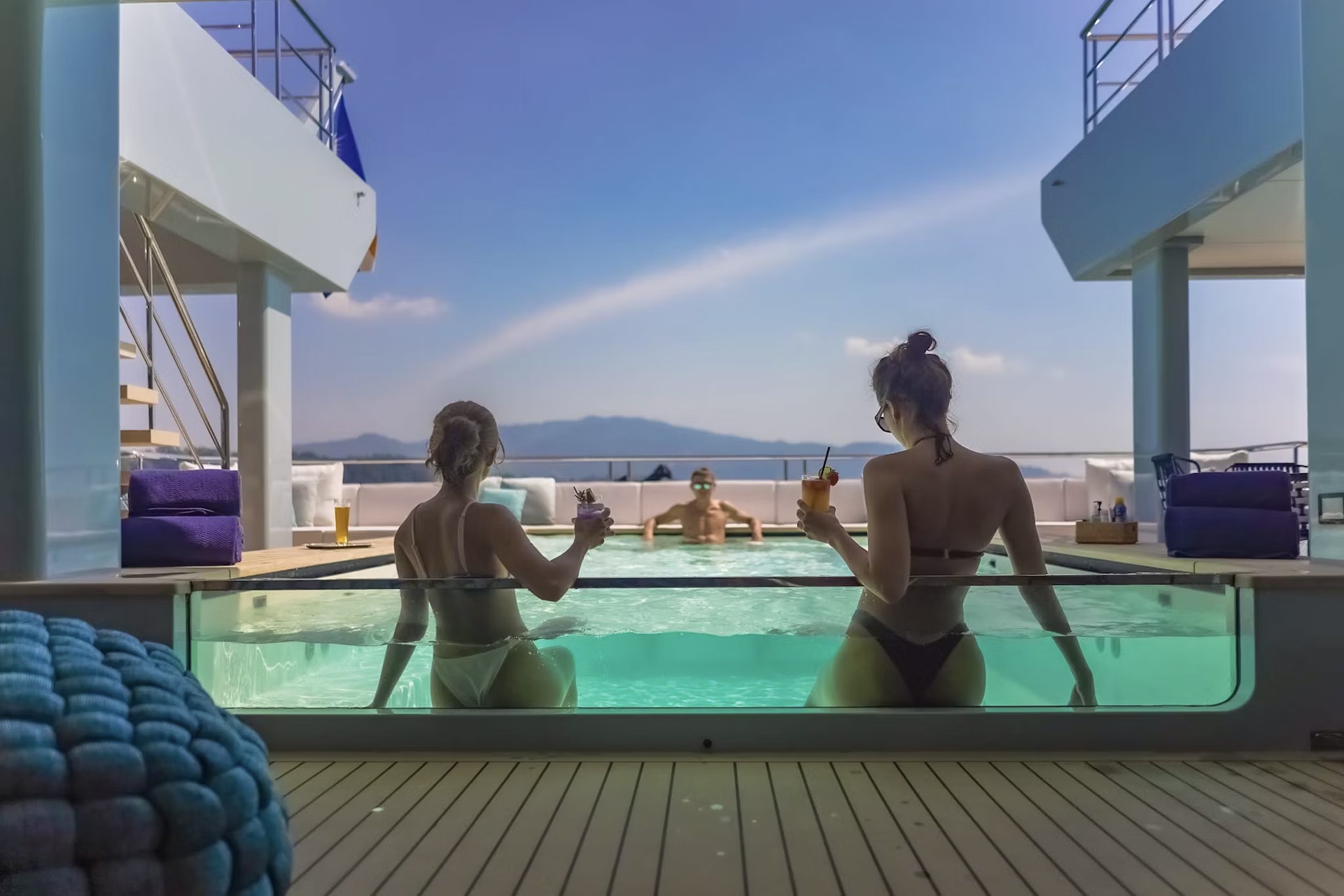 Friends enjoying cocktails on White Lotus Yacht SPACECAT