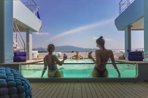 Friends enjoying cocktails on White Lotus Yacht SPACECAT