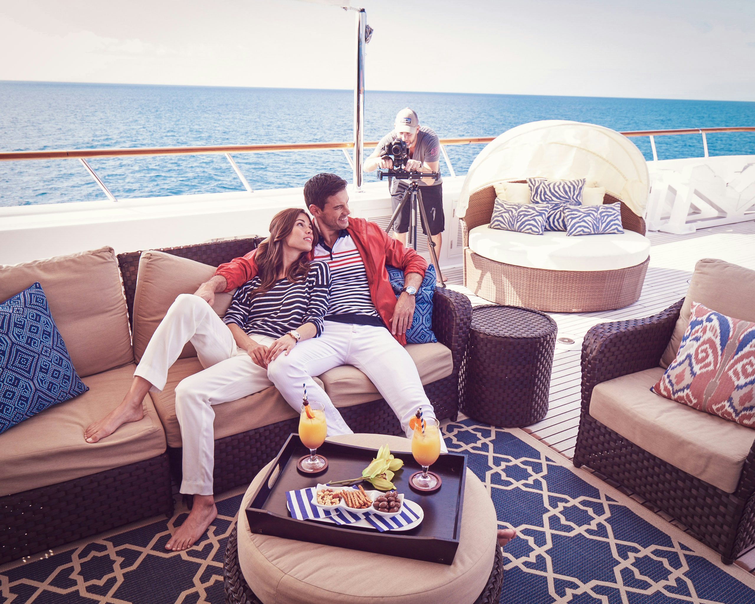 Photo Shoots Couple of models being photographed on board charter yacht