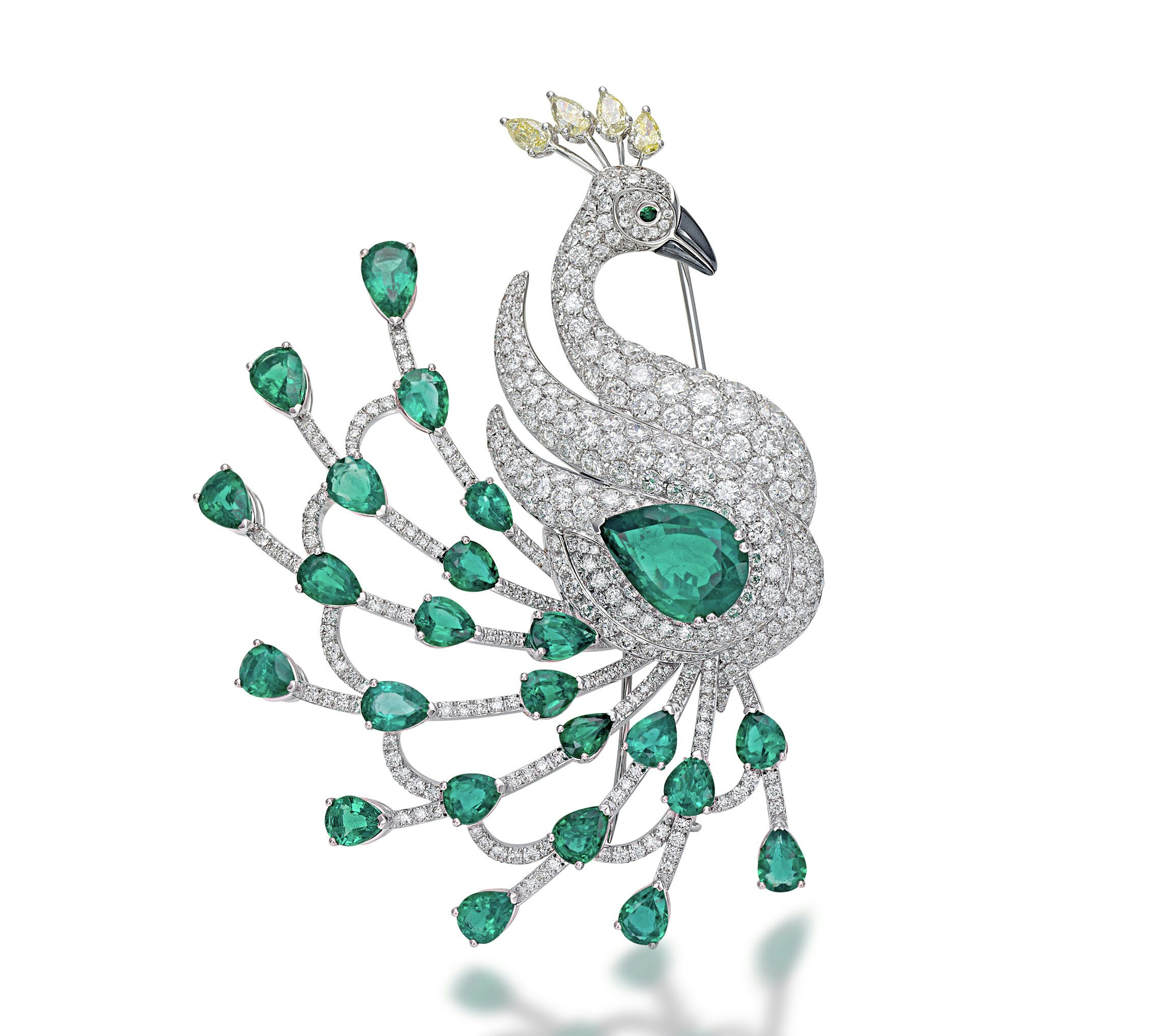 Peacock brooch with emeralds, white diamonds, yellow diamonds and hematite by Picchiotti