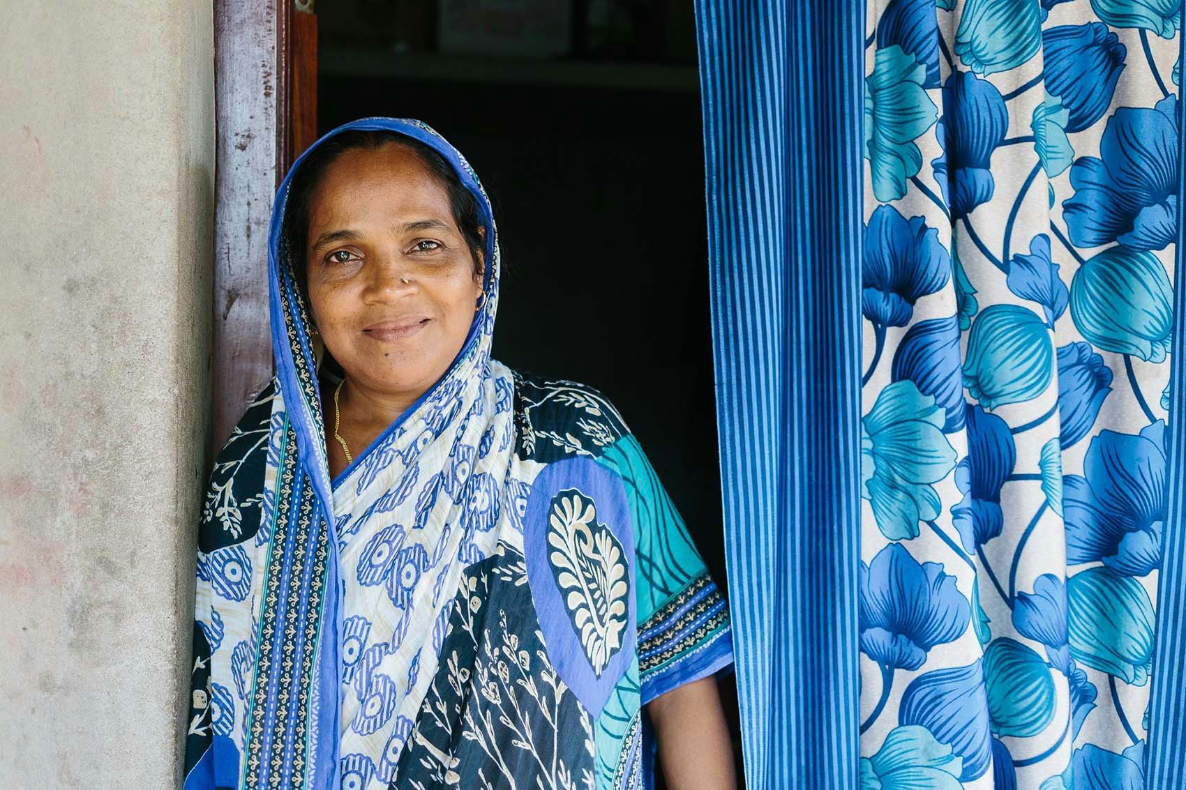 Rehana Water.org woman in blue smiling for the camera