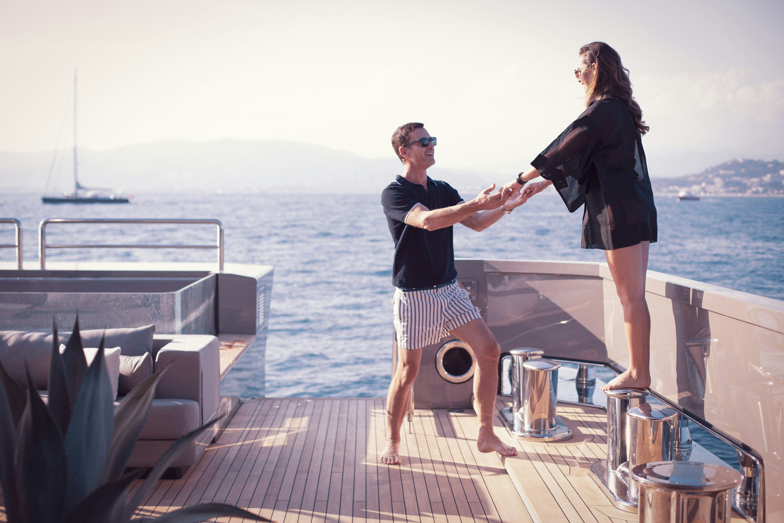 Running_Costs-2 Couple holding hands on board charter yacht