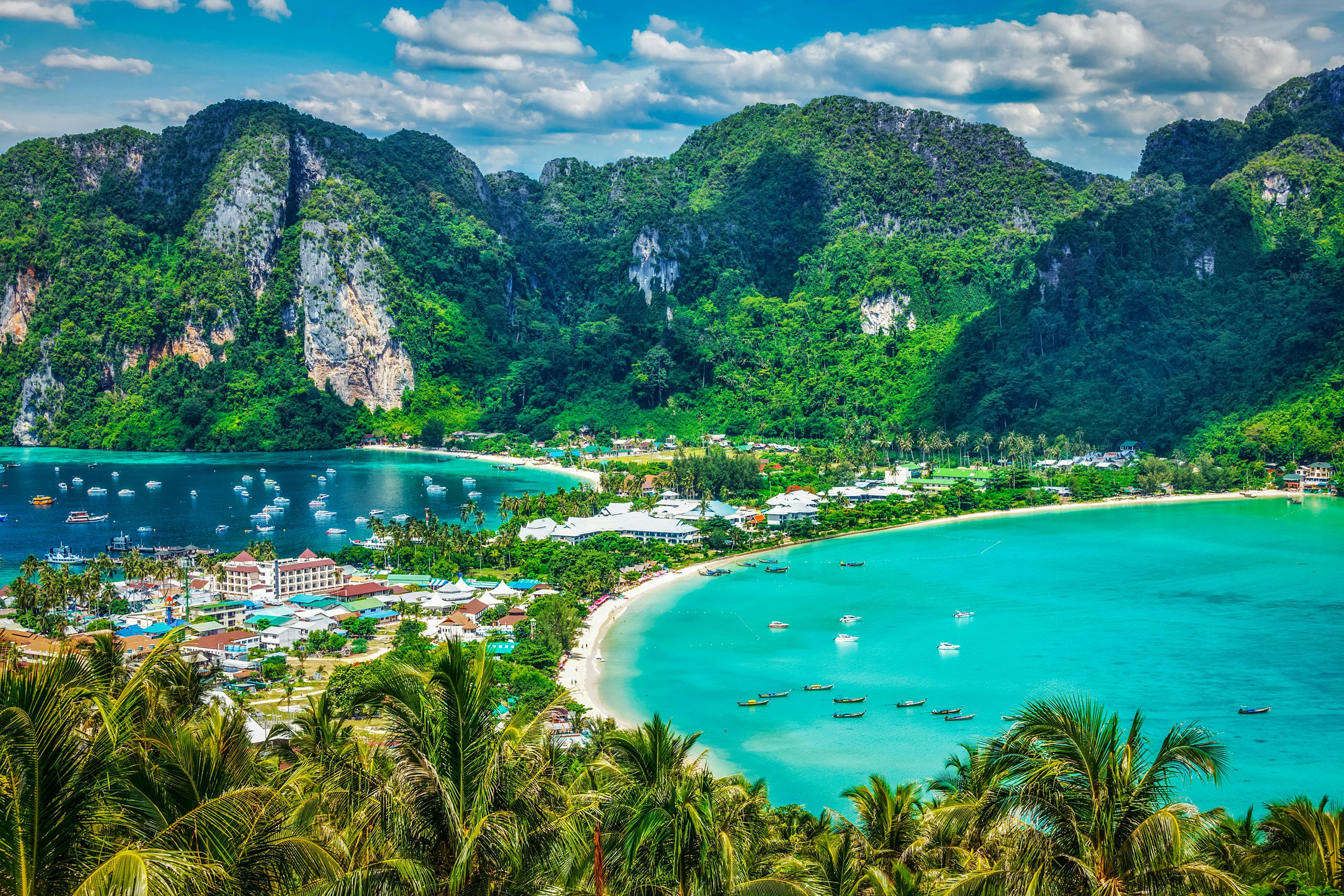 Thailand Luxury Yacht Charter - Travel vacation background - Tropical island with resorts - Phi-Phi island, Krabi Province, Thailand