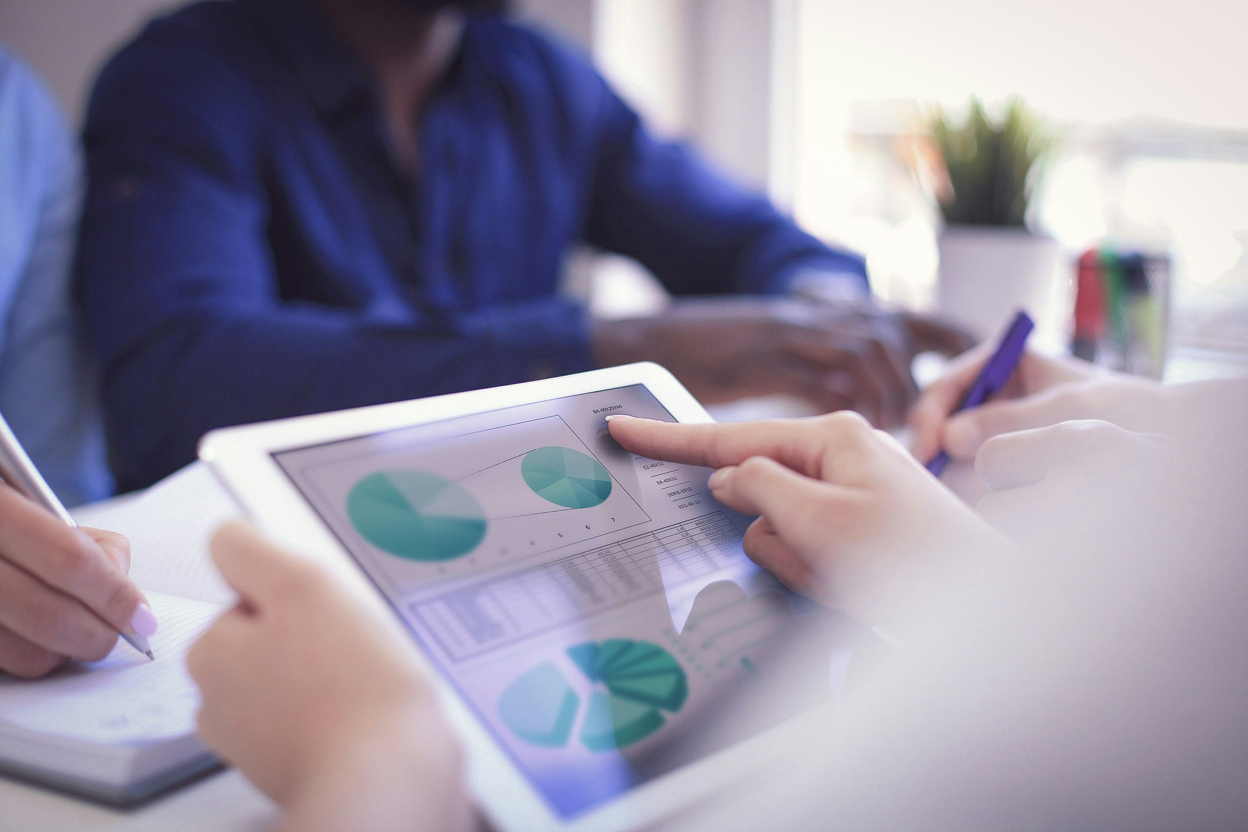 SEO agency SEO specialist analyzing statistics displayed on the tablet screen