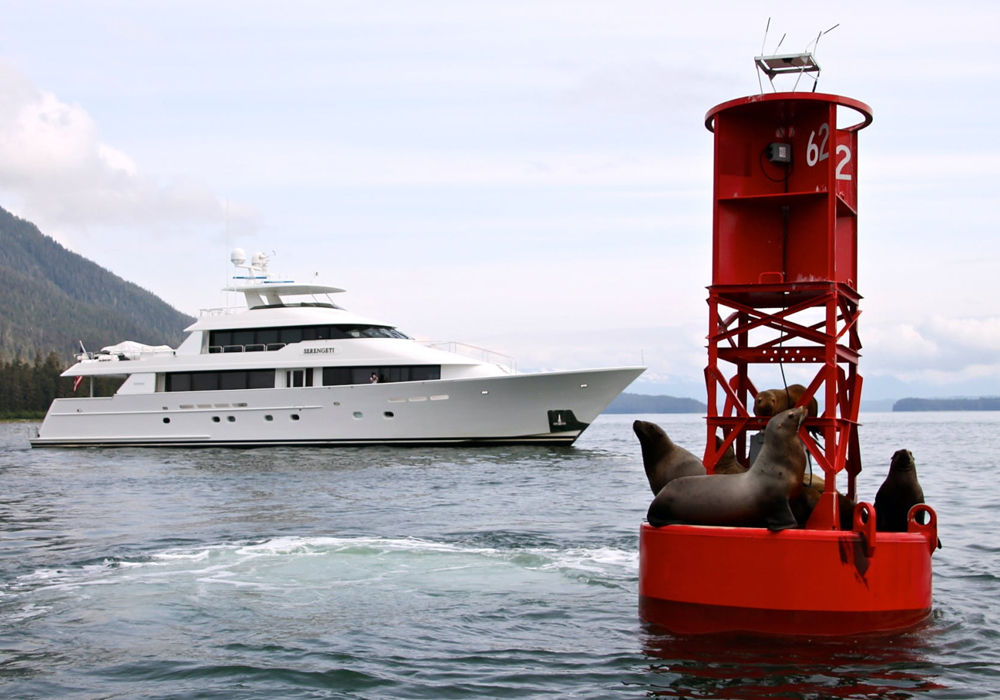 Charter Yacht SERENGETI by a channel marker that with seals in Alaska