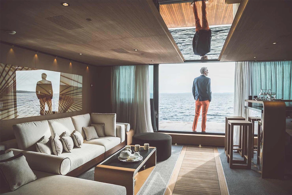 Man on fold-out balcony aboard SUERTE