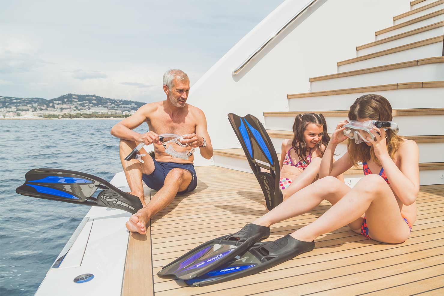 Family on SUERTE's aft deck about to go snorkeling