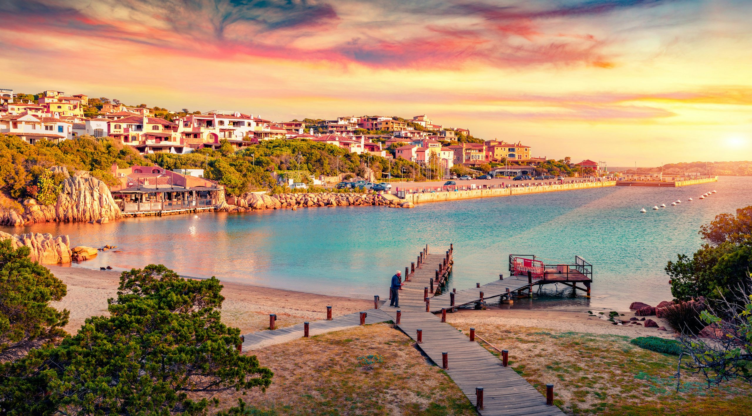 Sunset Serenade - The West Mediterranean's Coastal Charm Sunset over a tranquil West Mediterranean beach town with a picturesque pier.