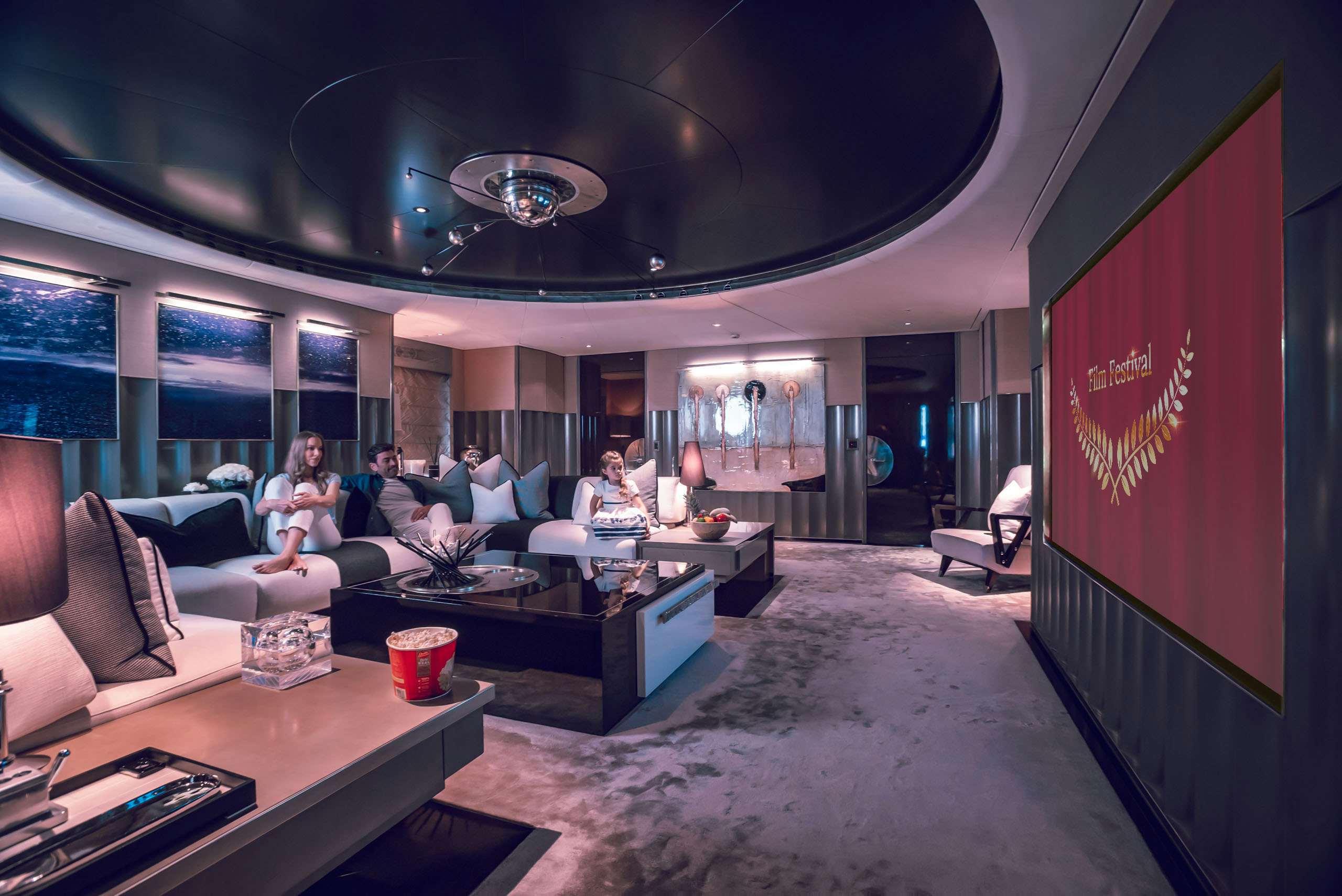 Family enjoying a movie on board superyacht during the Cannes Film Festival