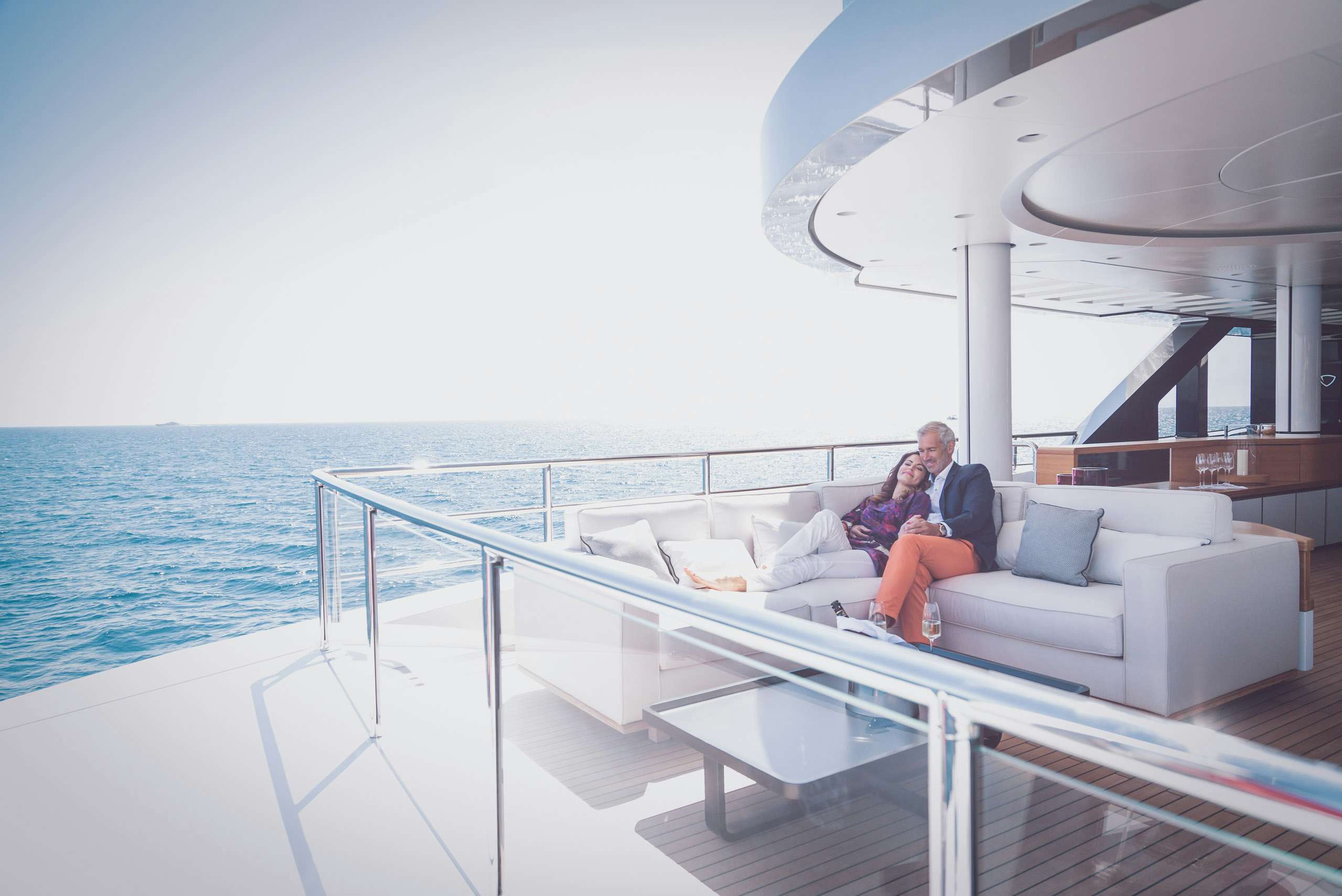 Couple Sitting on Luxury Yacht Deck