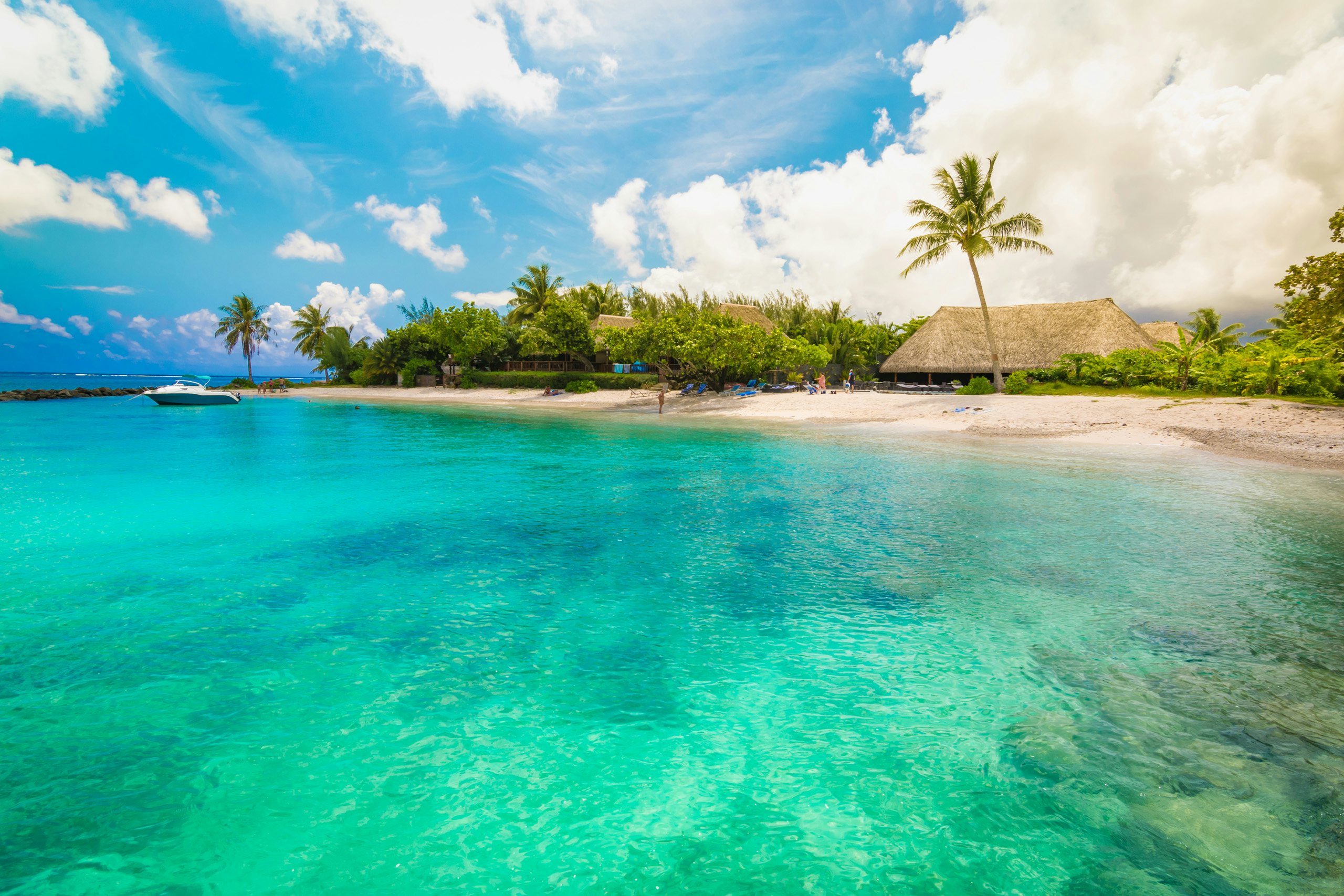 Society Islands Yacht Charter - South Pacific_Huahine Society Islands Yacht Charter - The tropical island of Huahine with crystal waters and palm trees