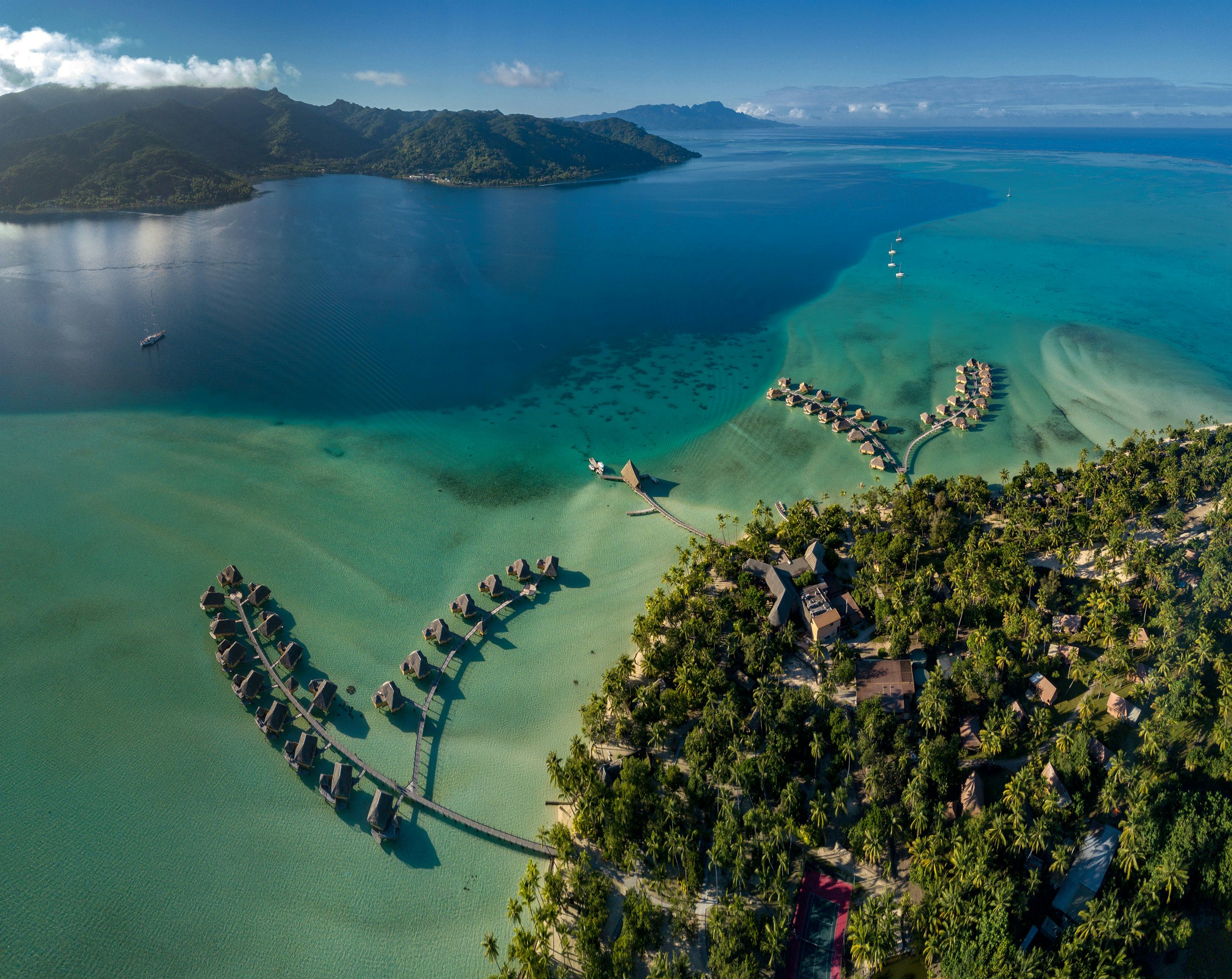 Society Islands Crewed Yacht Charter -South Pacific_Taha'a Society Islands Crewed Yacht Charter -Taha's's beautiful waters and lush greenery