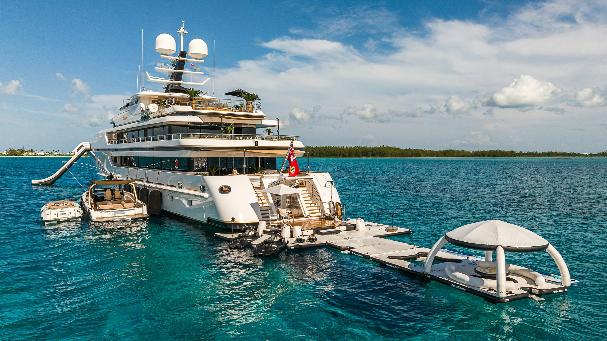 Luxury yacht anchored in The Bahamas with all the toys setup for guests