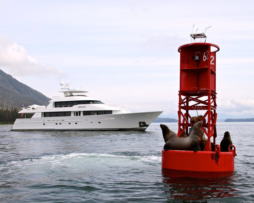 Alaska luxury yacht charter Serengetti at anchor viewing seals and whale watching