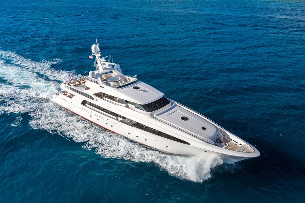 Side profile of superyacht USHER on the water