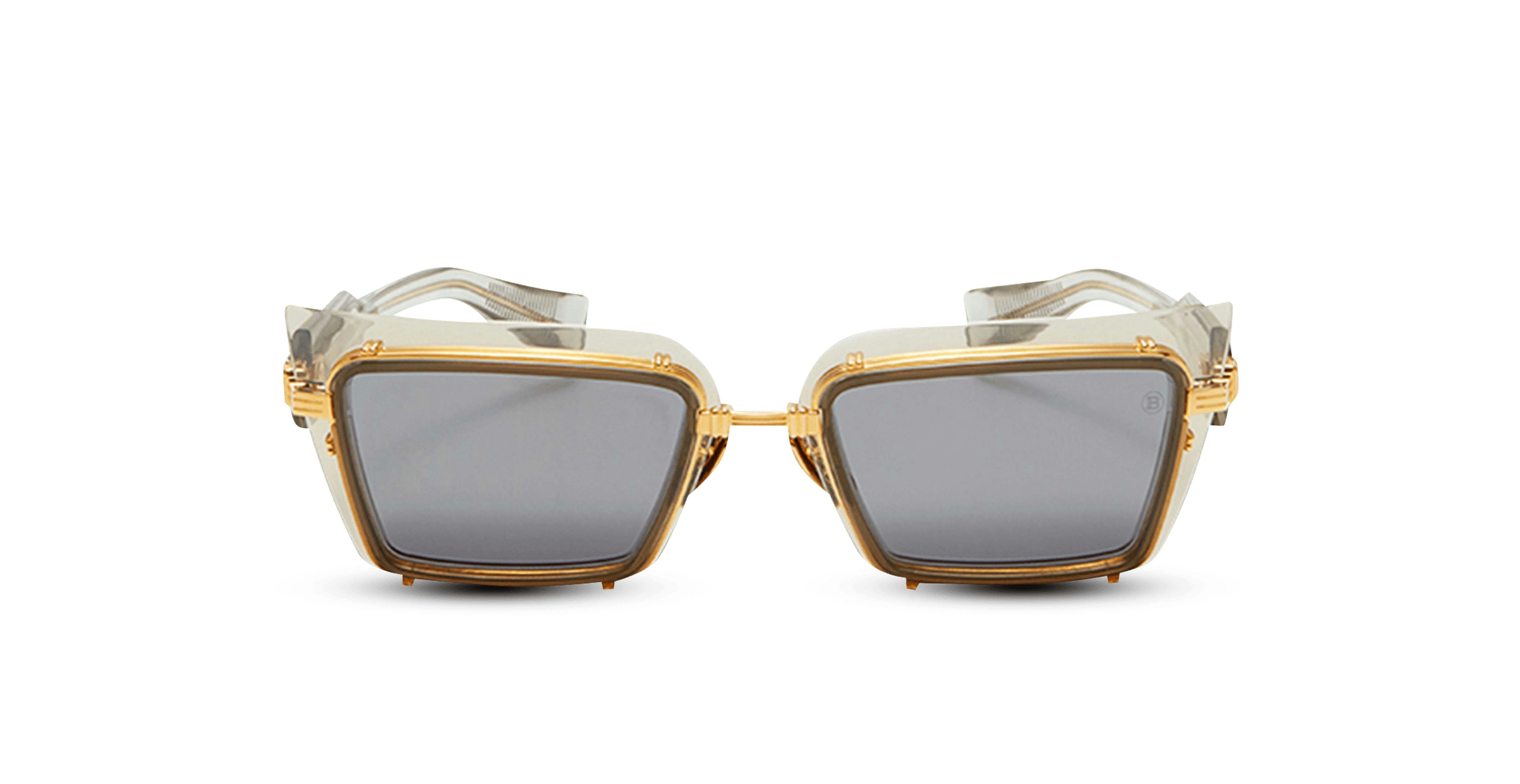 Women&#039;s sunglasses with gold details and dark lenses