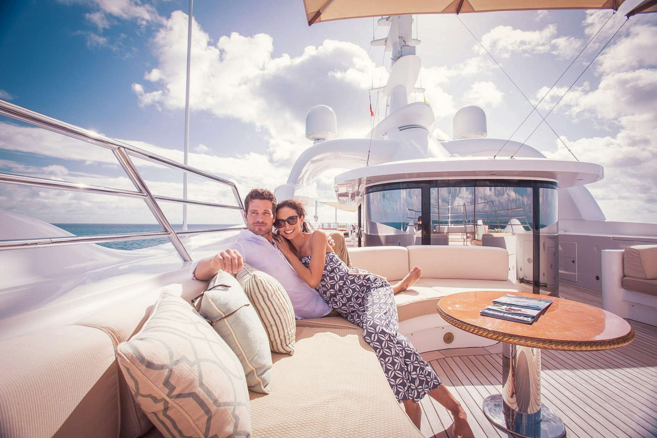 Couple relaxing together on board superyacht
