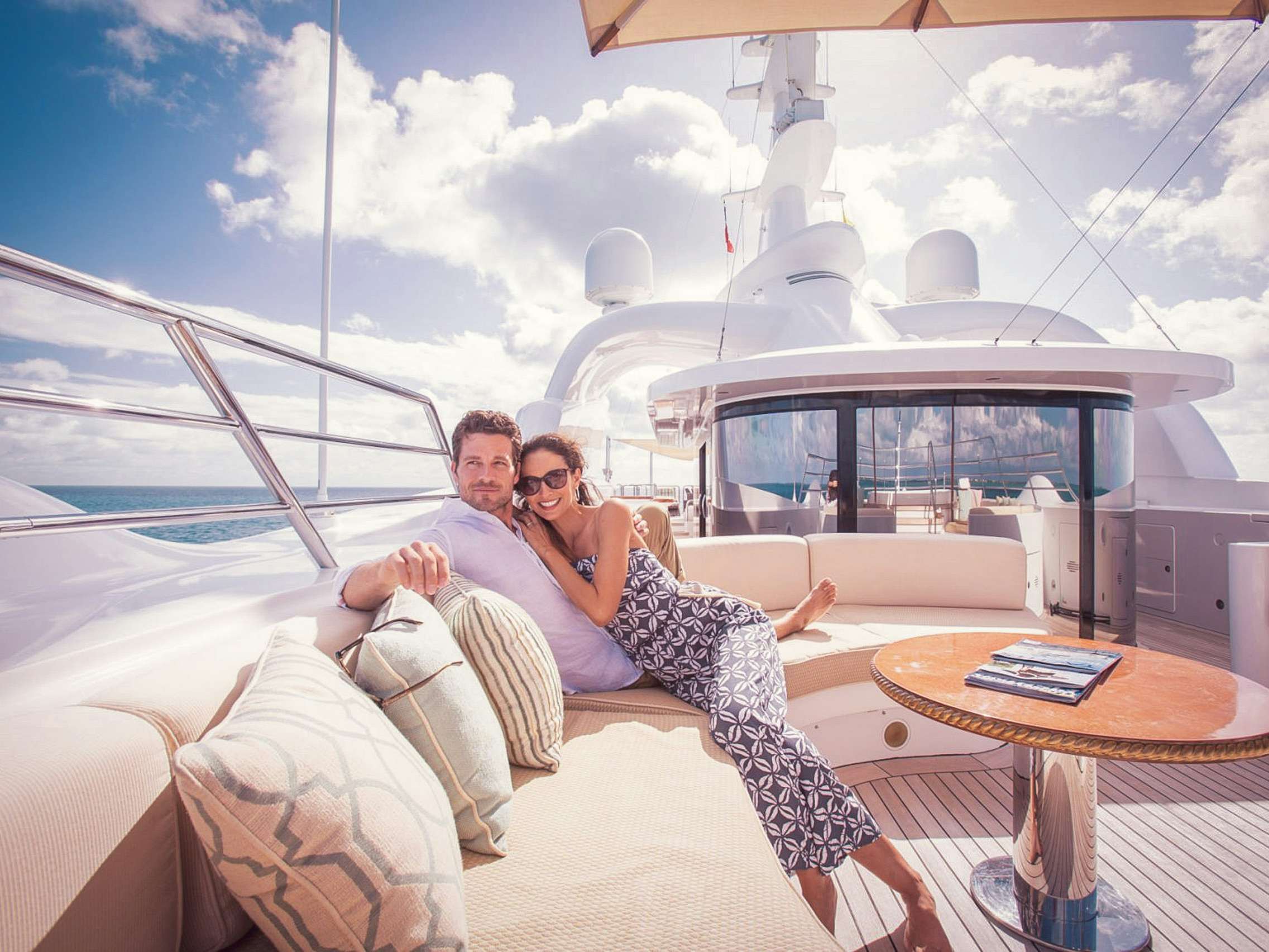 Couple relaxing together on board superyacht