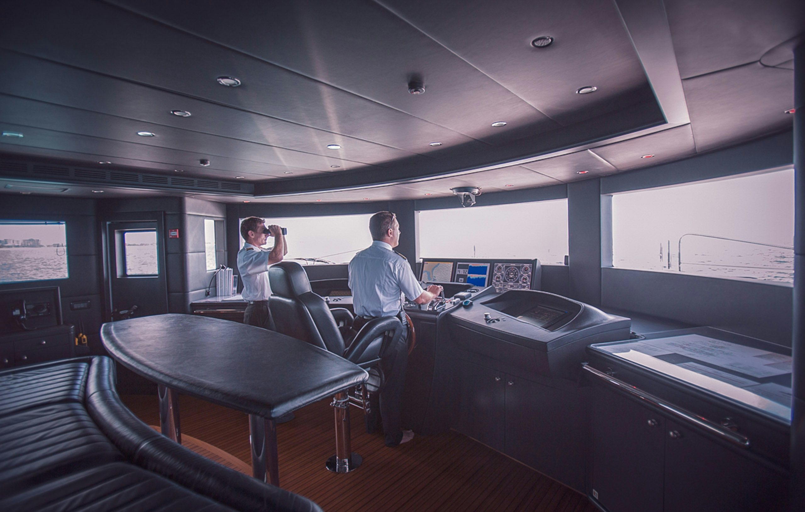 Captain and first mate scouting ahead from bridge