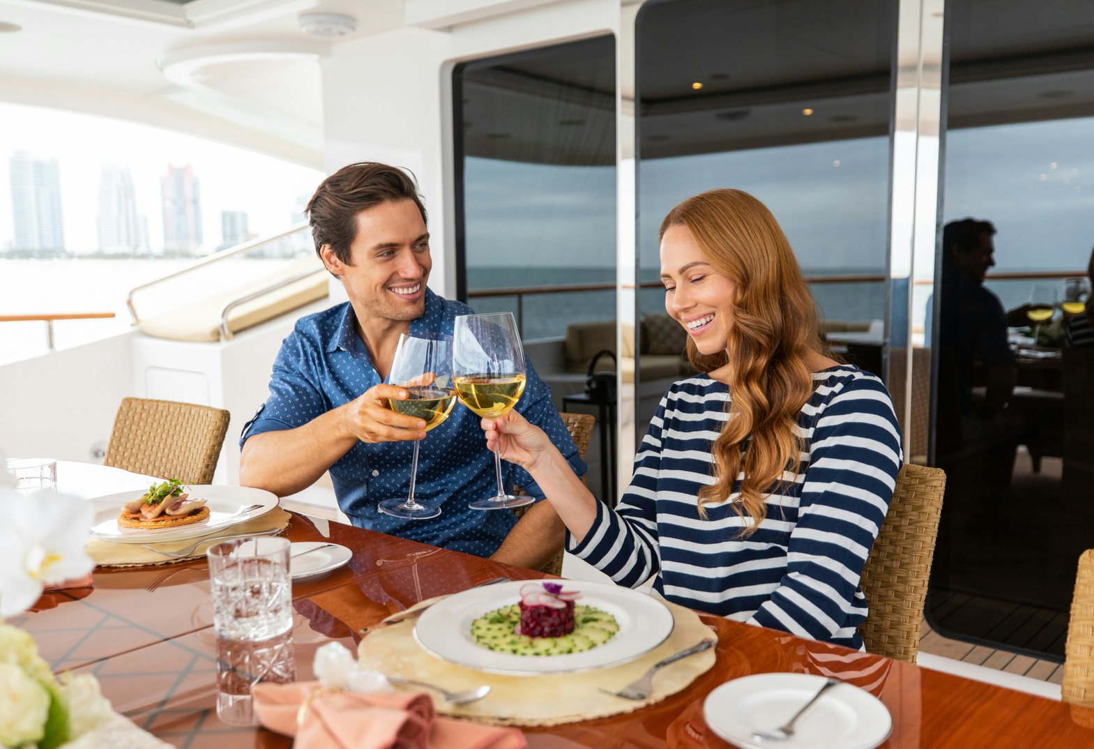 guests onboard a yacht cheers