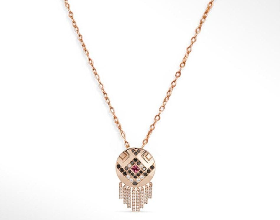 Medallion in 18K gold with white diamonds and black diamonds