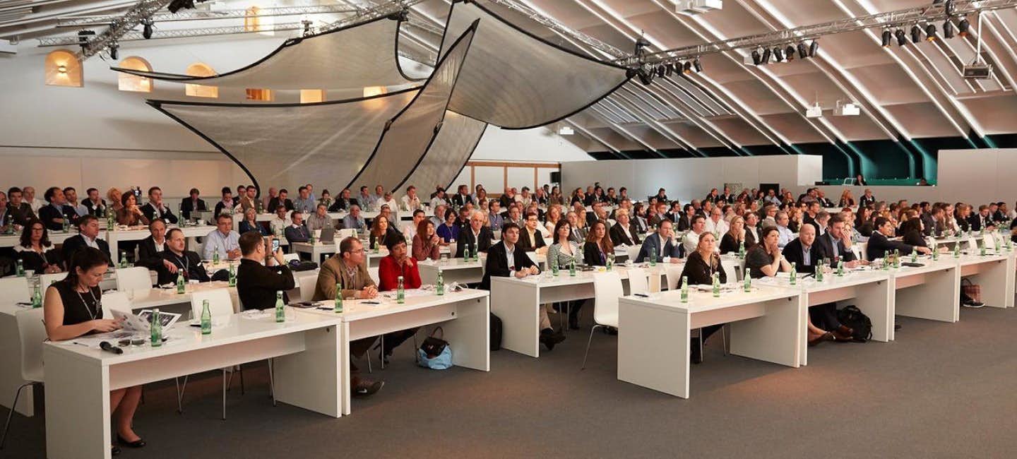 A captivated audience of professionals attending a conference session during the Superyacht Design Festival.