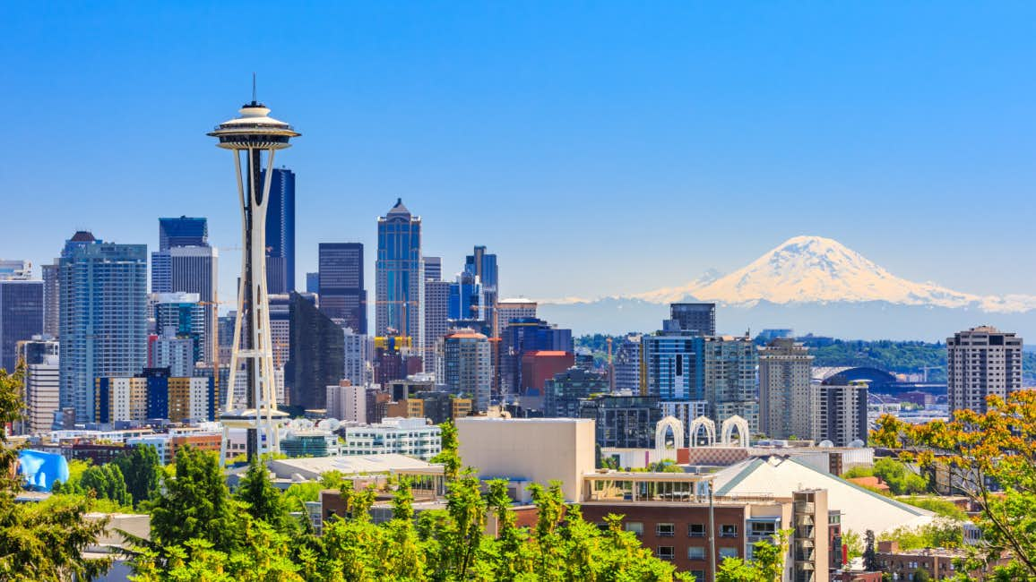 A picturesque view of the Seattle skyline on a sunny day, as seen during the Seattle Boat Show