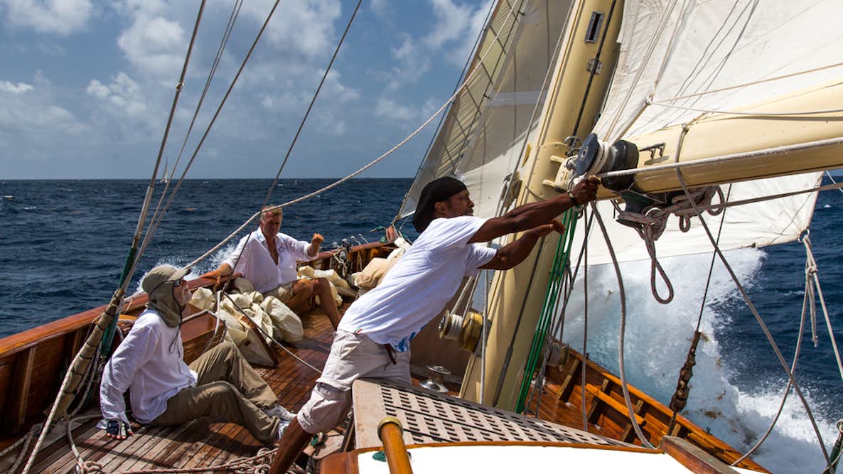 crew and guests on a classic sailing boat during the Antigua Classic Regatta