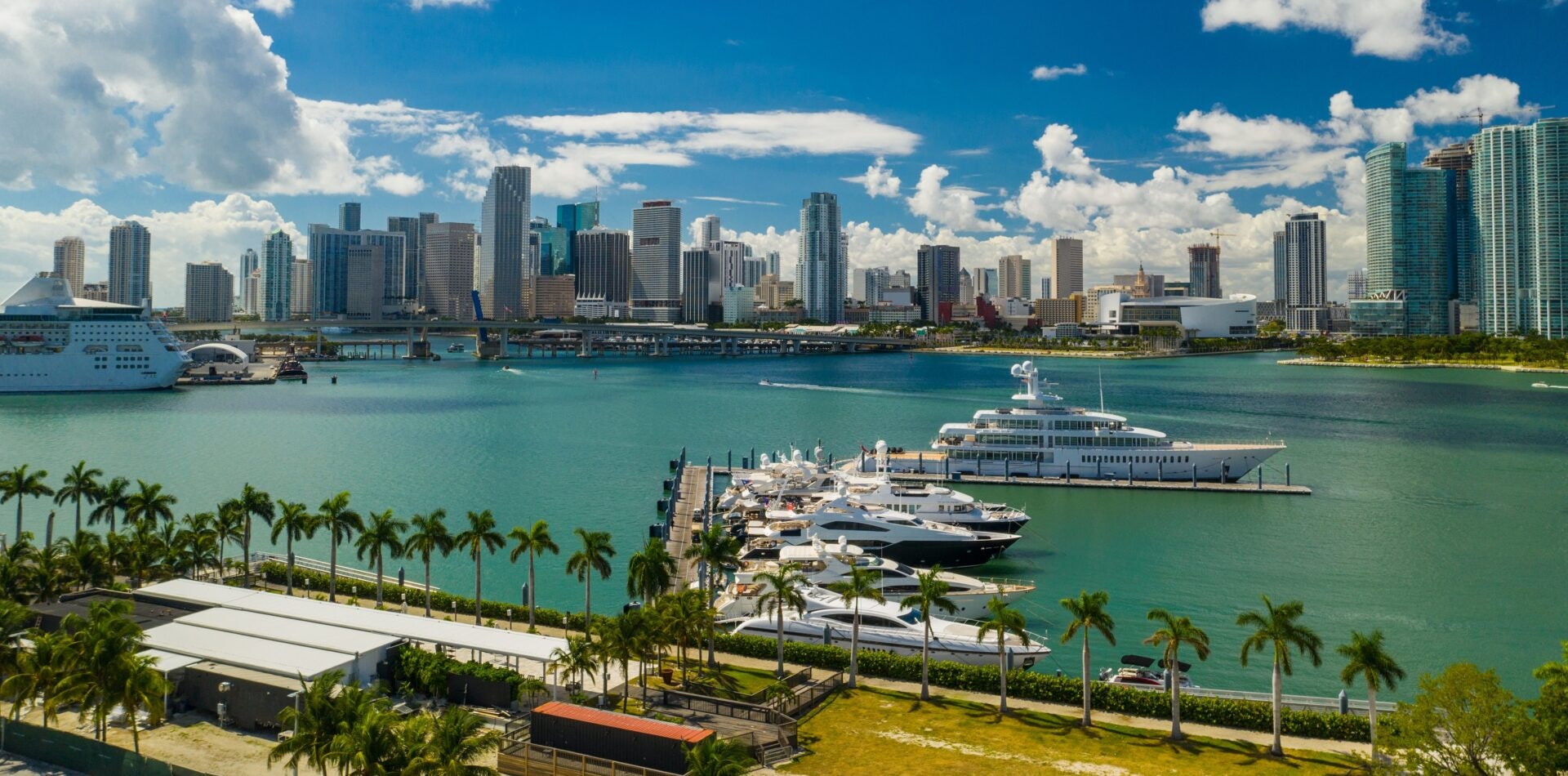 A radiant day with sunshine illuminating Miami Port, the vibrant setting of the Miami International Boat Show.