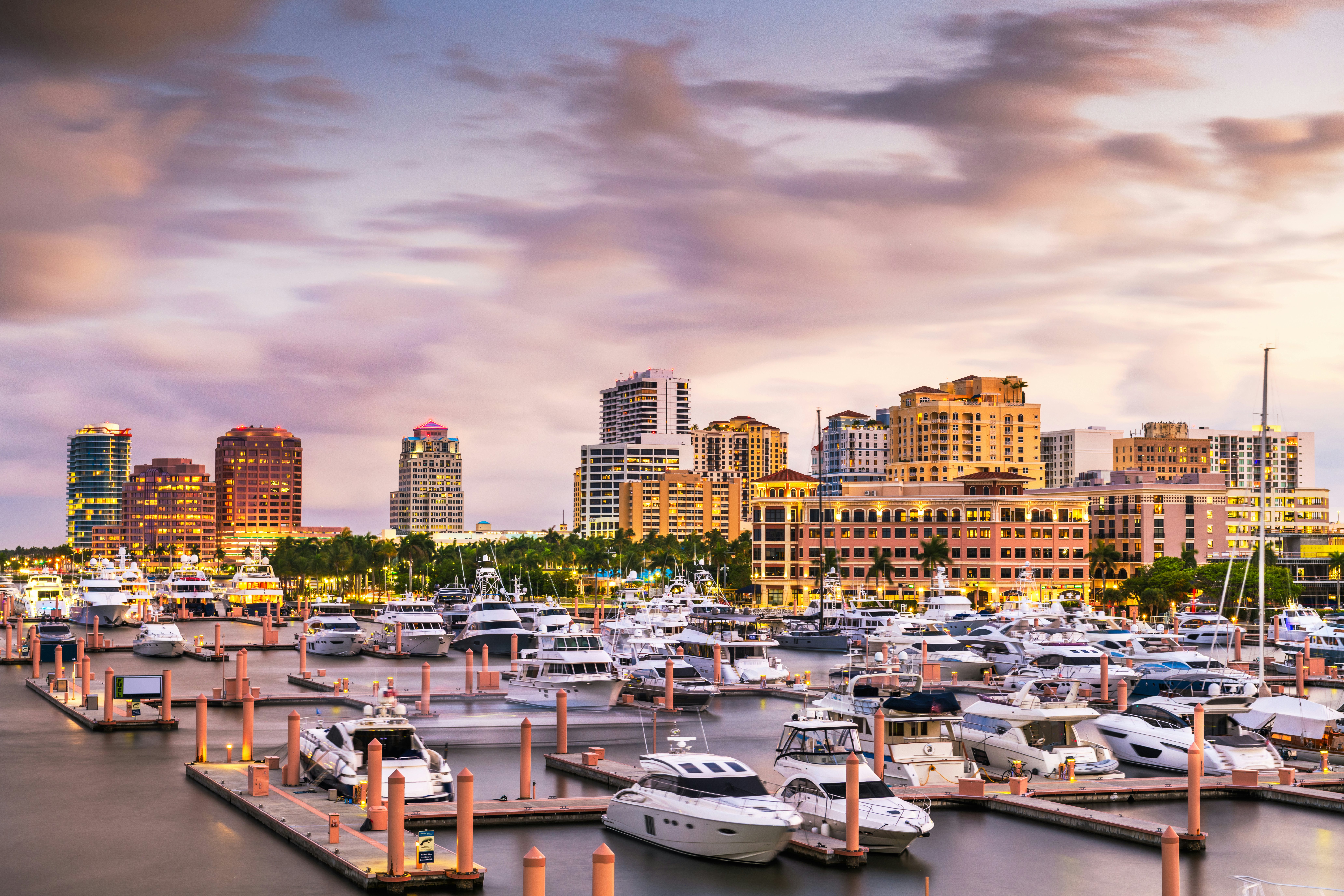 A captivating view of the Palm Beach skyline at sunset in front of the port, creating a picturesque scene during the Palm Beach International Boat Show in West Palm Beach, Florida, USA.