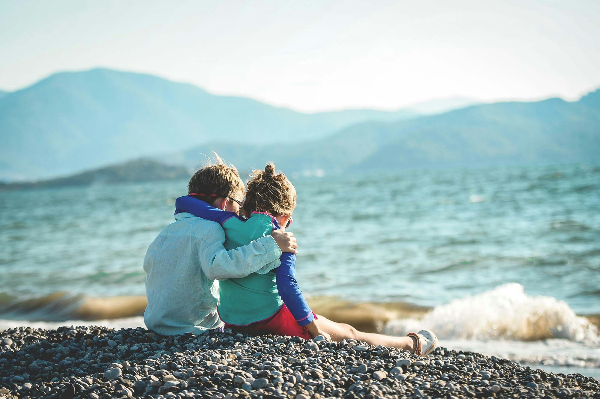 photo of two children on the beach