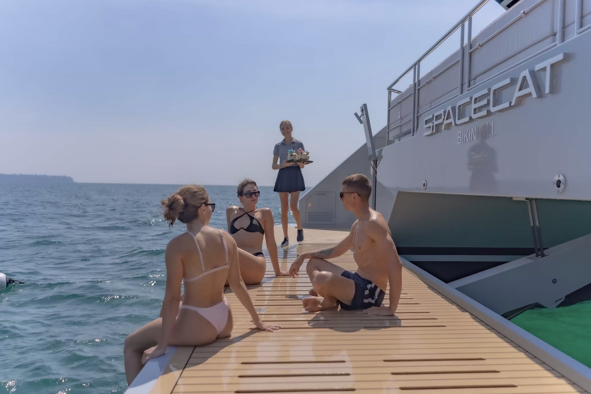 Family enjoying SPACECAT, the White Lotus Yacht for Charter